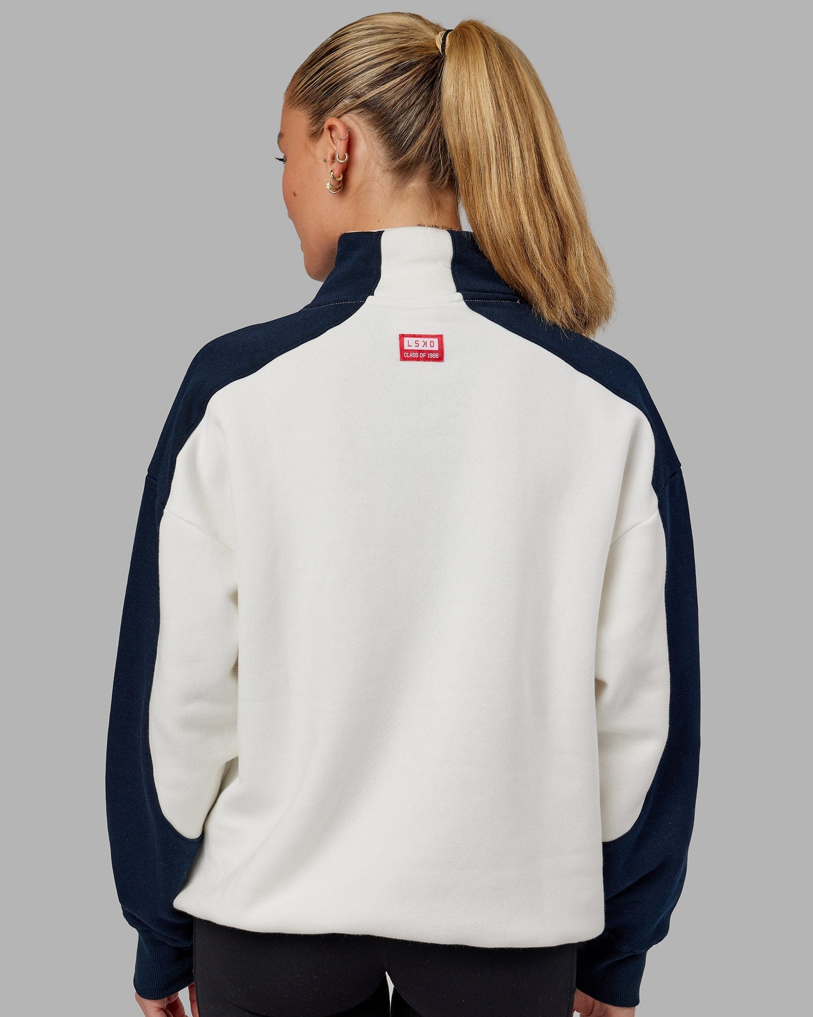 Model wearing Unisex Alumni 1/4 Zip Sweater Oversize - Navy-Red