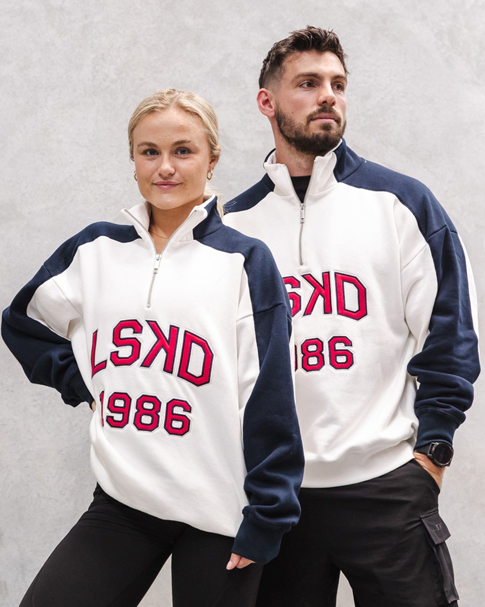 Model wearing Unisex Alumni 1/4 Zip Sweater Oversize - Navy-Red