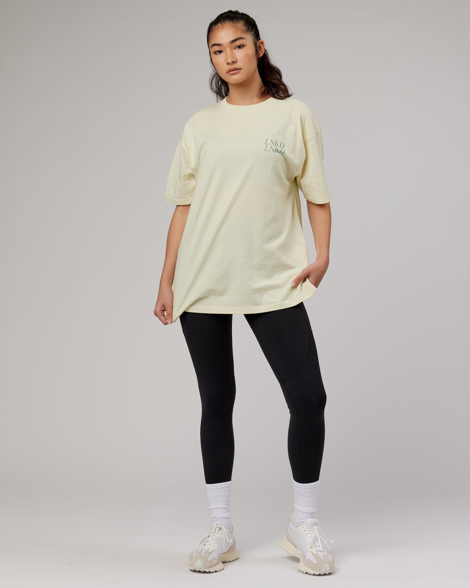 Model wearing Aurora Oversize Tee - Almond Milk