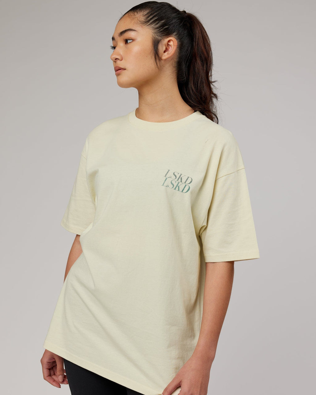 Model wearing Aurora Oversize Tee - Almond Milk