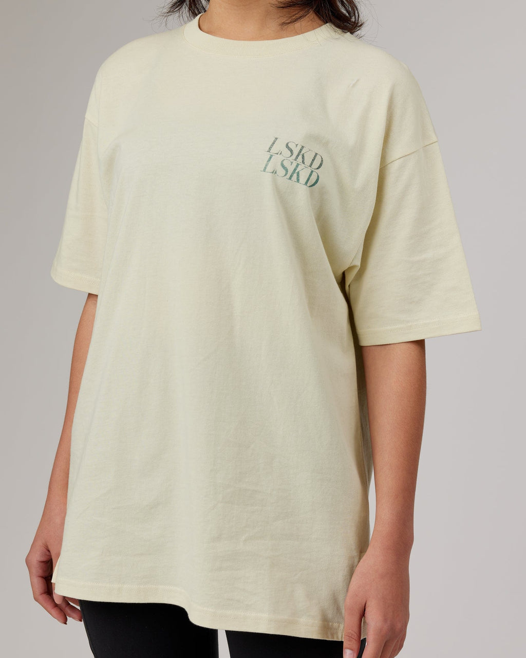 Model wearing Aurora Oversize Tee - Almond Milk