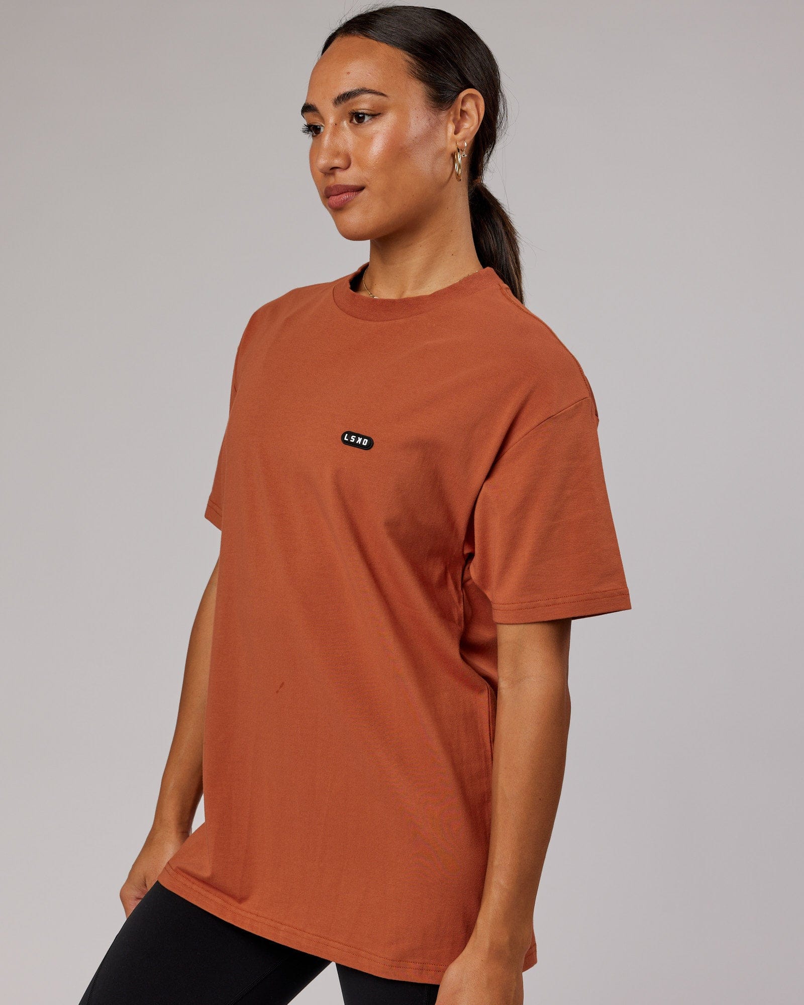 Model wearing Unisex Capsule FLXCotton Tee Oversize - Auburn