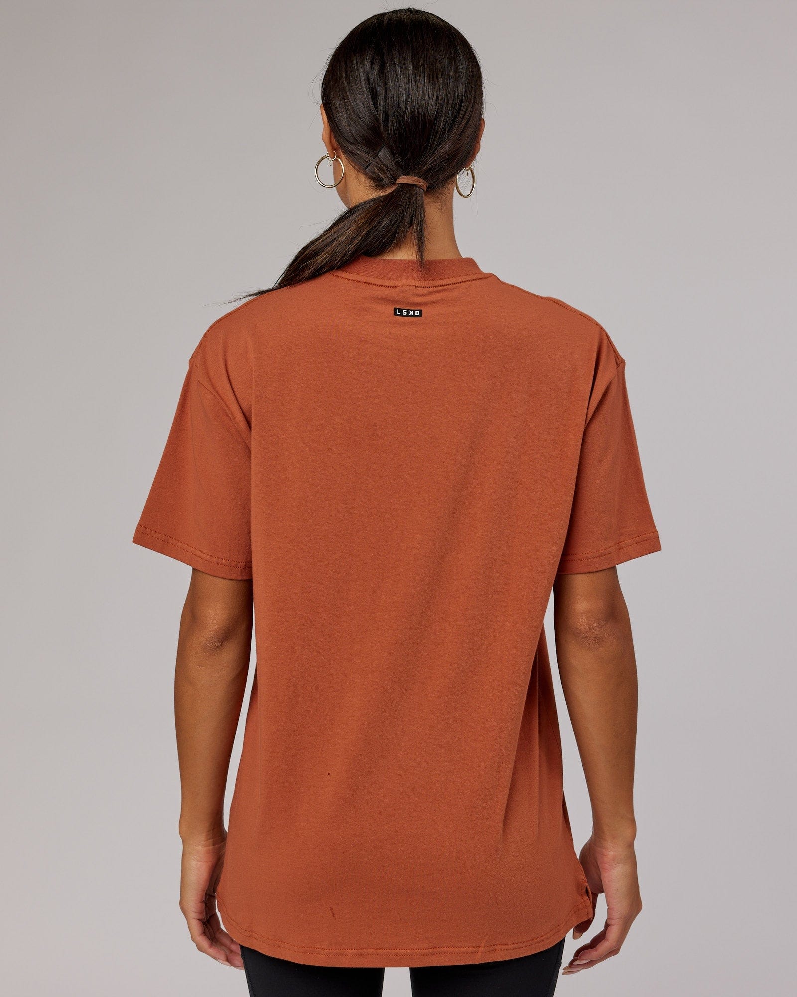 Model wearing Unisex Capsule FLXCotton Tee Oversize - Auburn