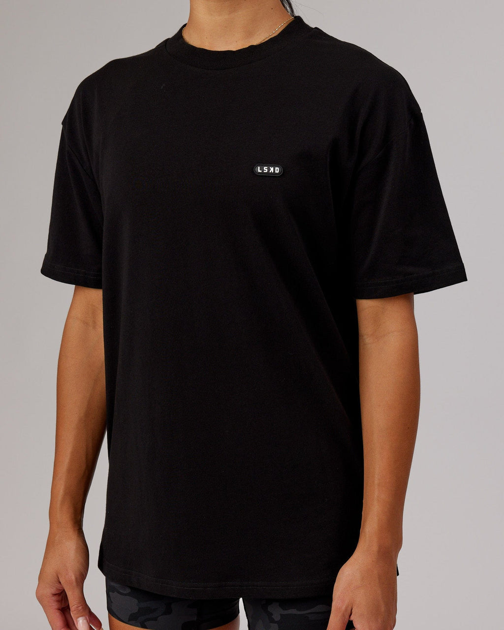 Model wearing Unisex Capsule FLXCotton Tee Oversize - Black