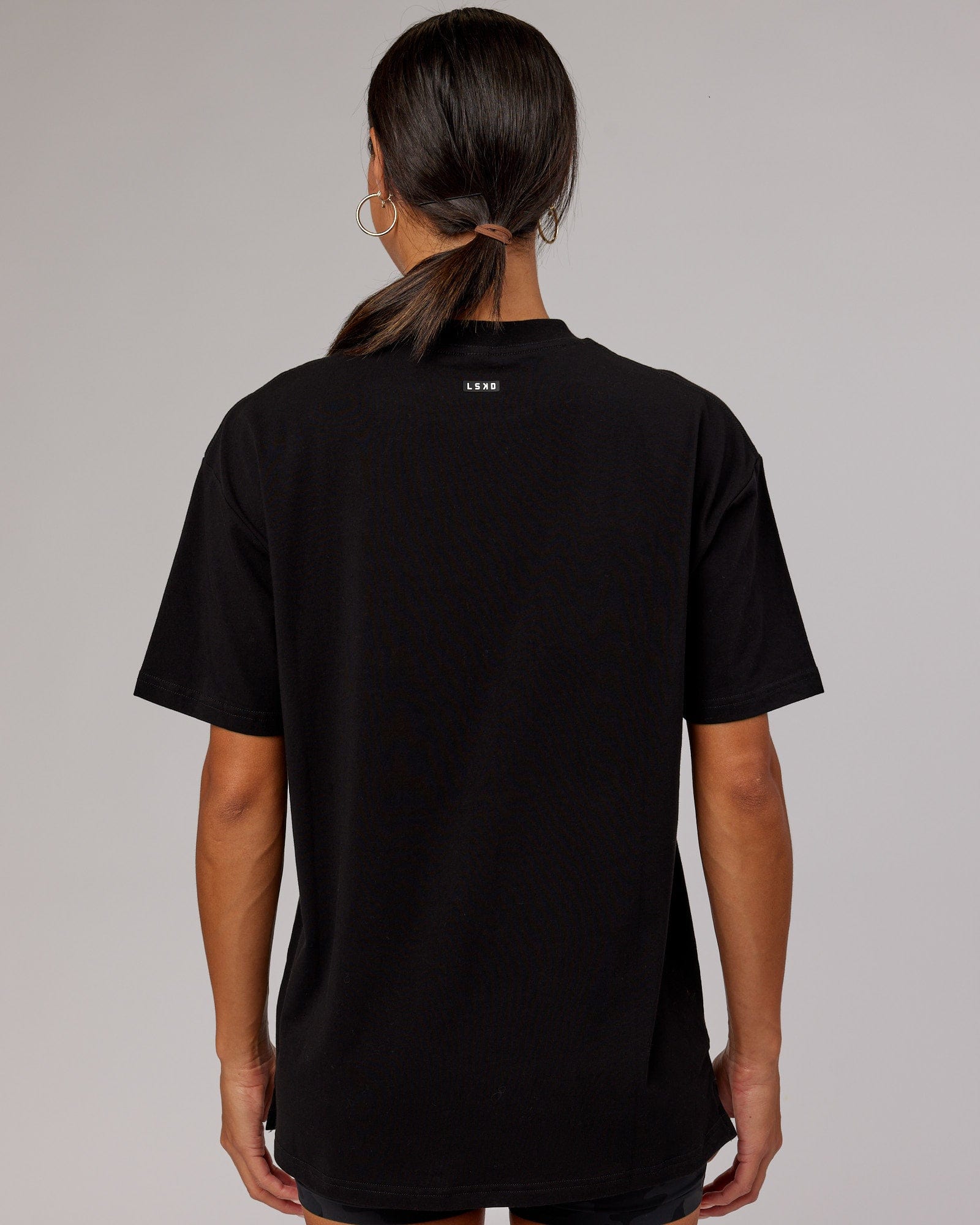 Model wearing Unisex Capsule FLXCotton Tee Oversize - Black