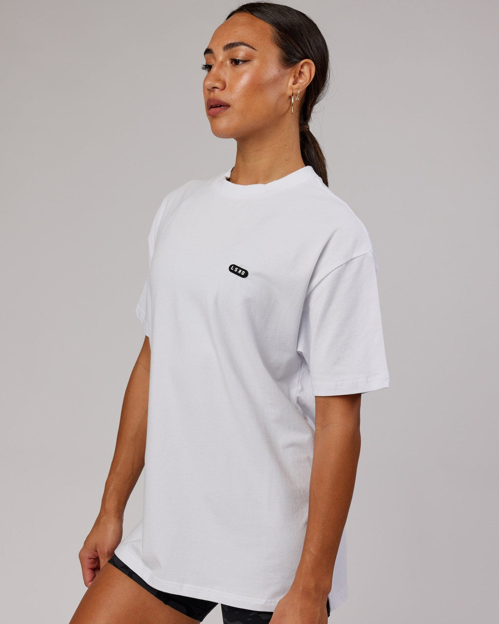 Model wearing Unisex Capsule FLXCotton Tee Oversize - White