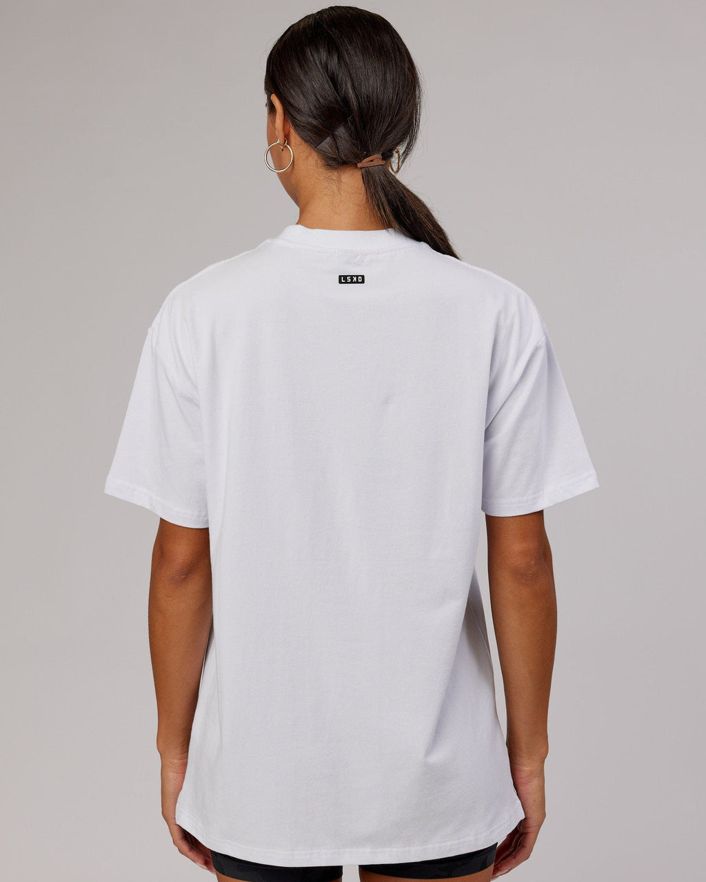 Model wearing Unisex Capsule FLXCotton Tee Oversize - White