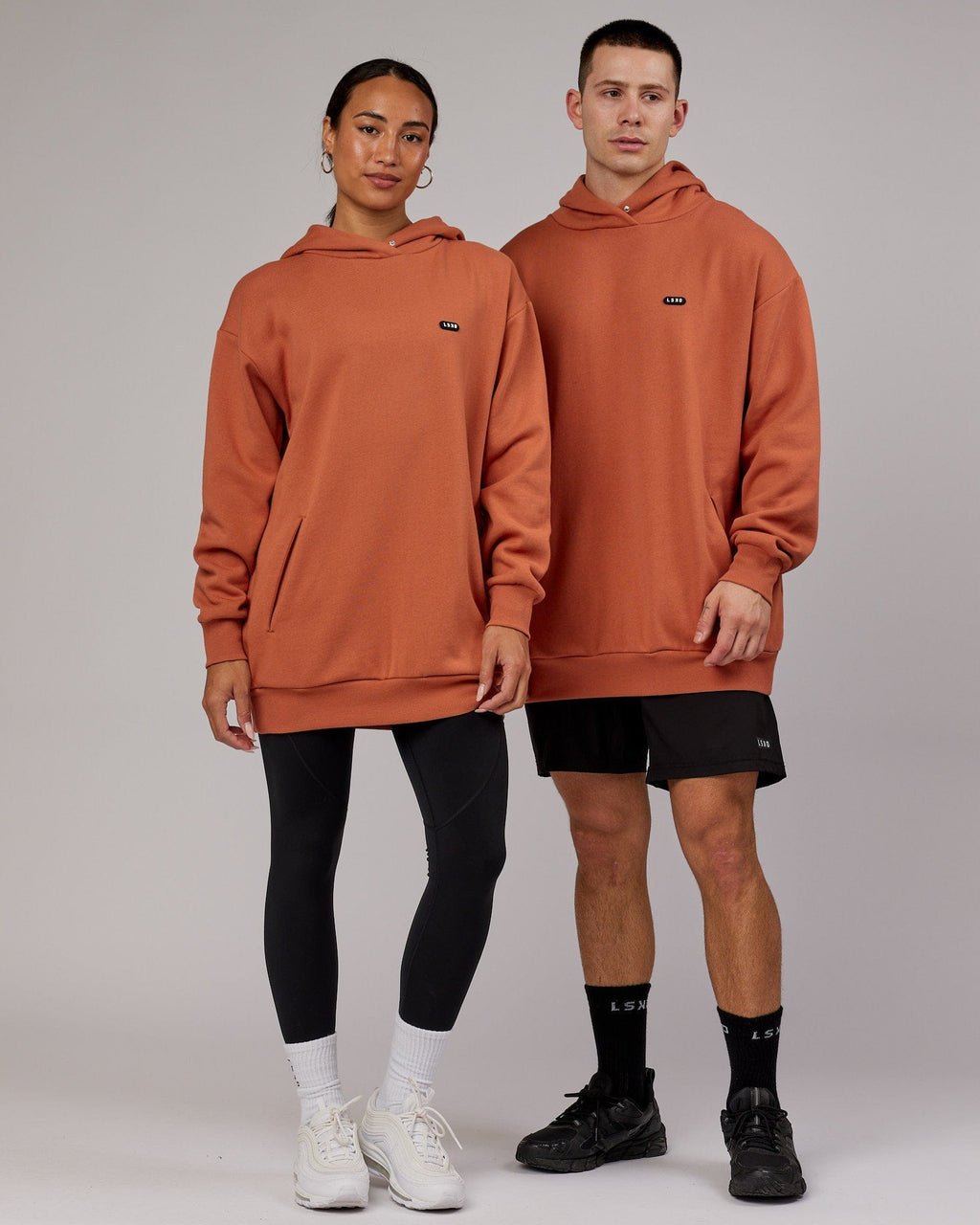 Model wearing Unisex Capsule Hoodie Oversize - Auburn