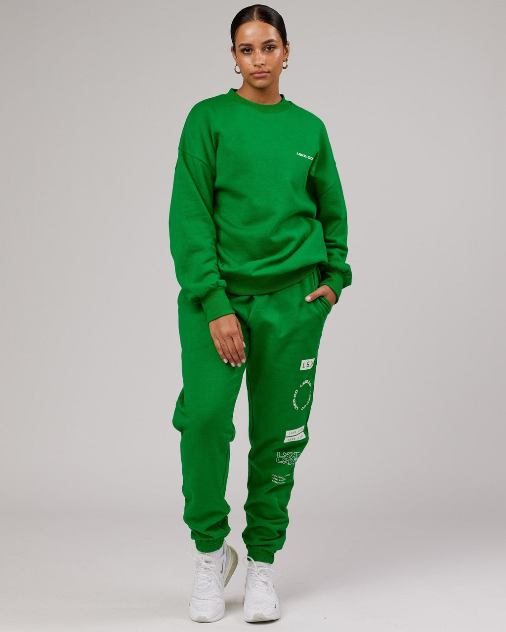 Model wearing Unisex Combo Track Pant - Vivid Green