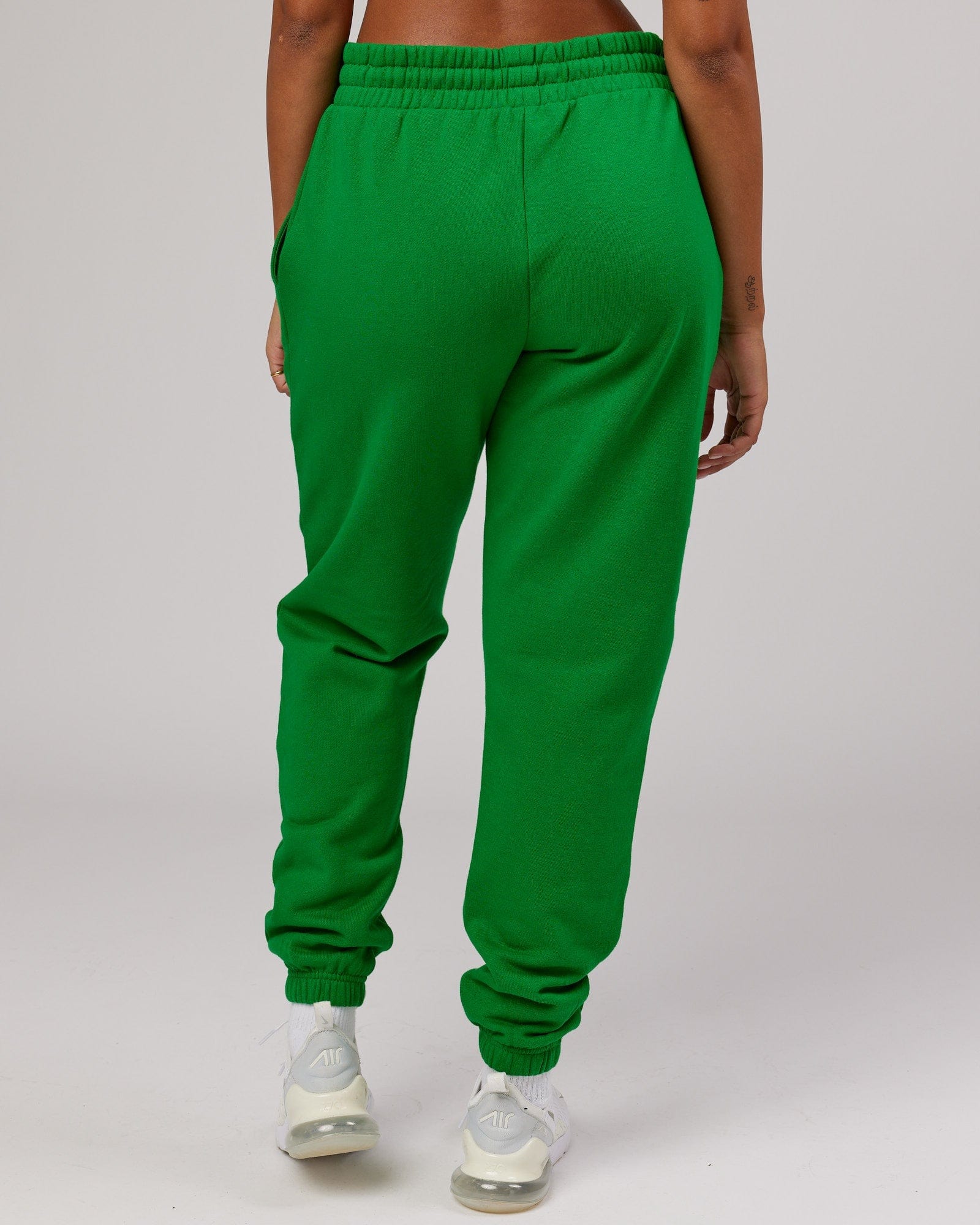 Model wearing Unisex Combo Track Pant - Vivid Green