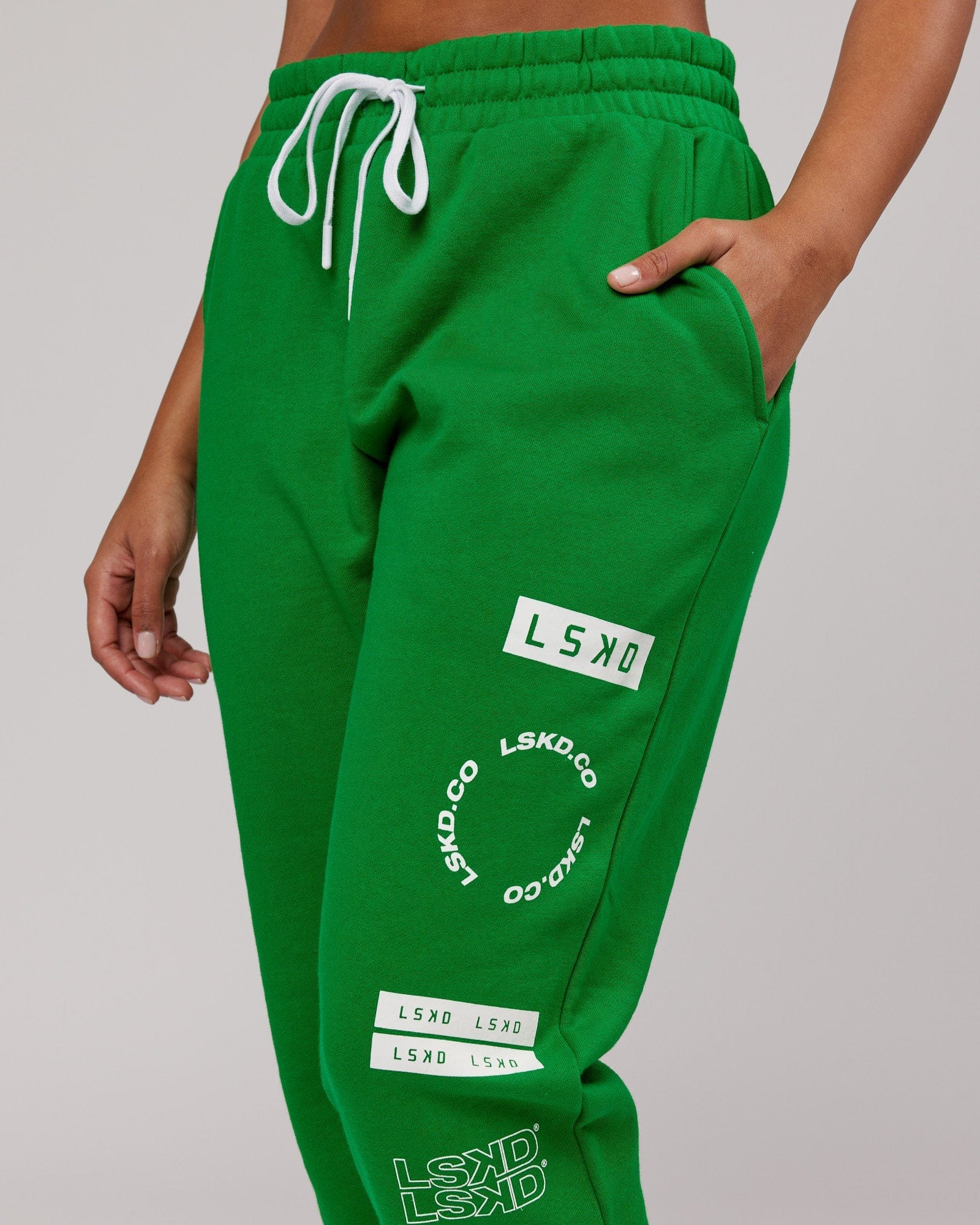 Model wearing Unisex Combo Track Pant - Vivid Green