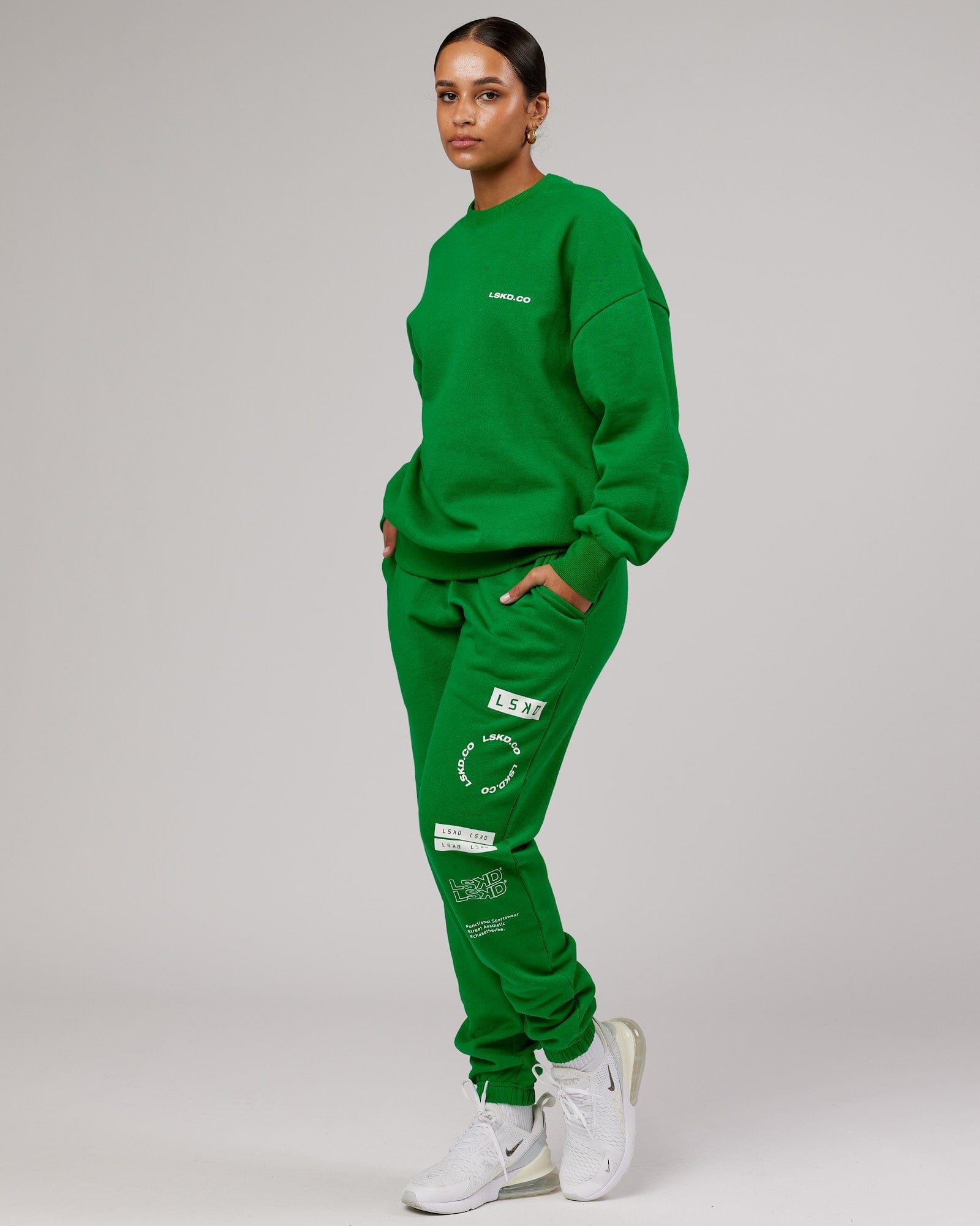 Model wearing Unisex Combo Track Pant - Vivid Green