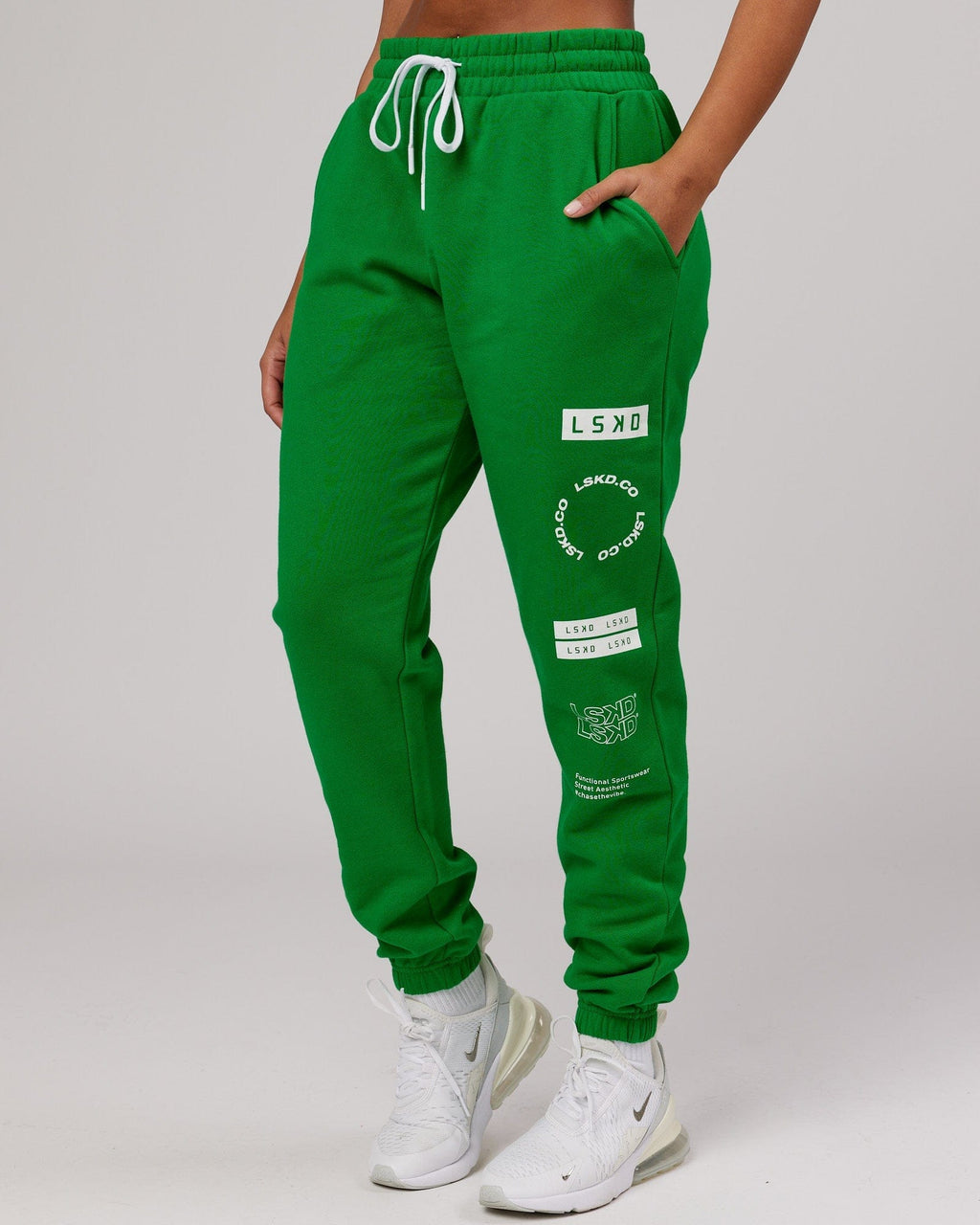 Model wearing Unisex Combo Track Pant - Vivid Green