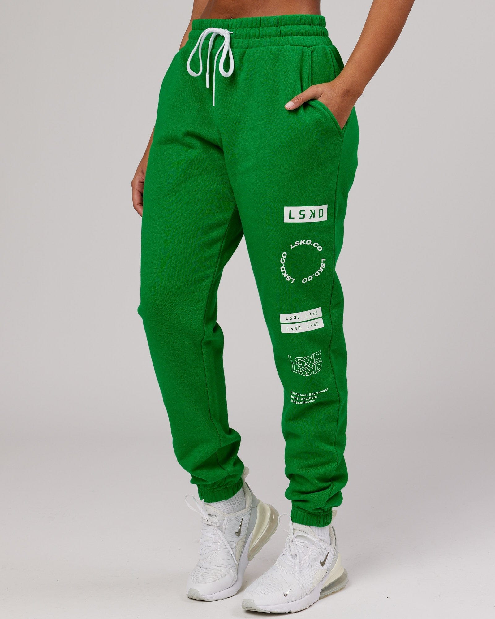 Model wearing Unisex Combo Track Pant - Vivid Green