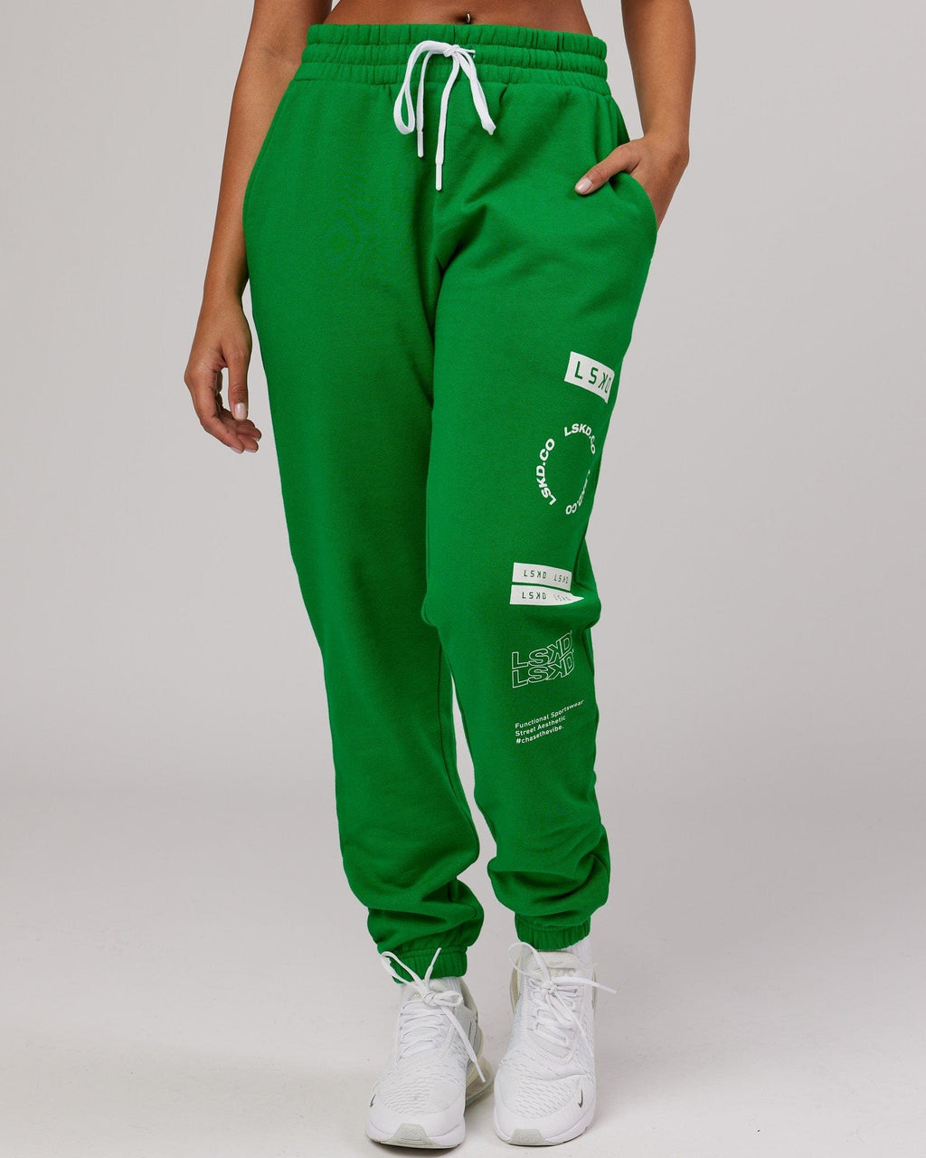 Model wearing Unisex Combo Track Pant - Vivid Green