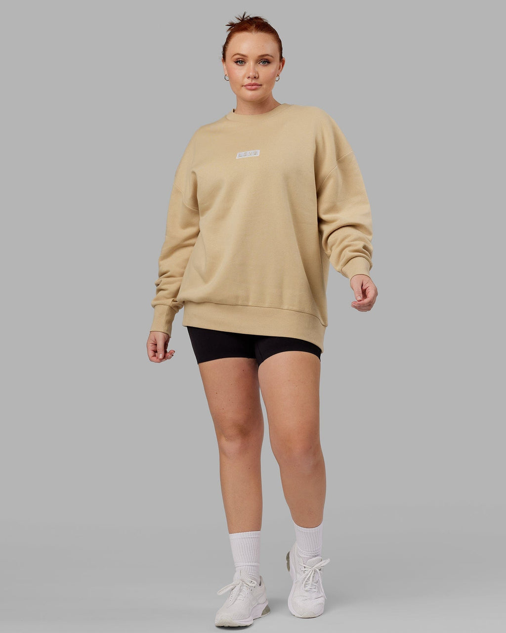 Model wearing Unisex Cornerstone Sweater Oversize - Pale Khaki