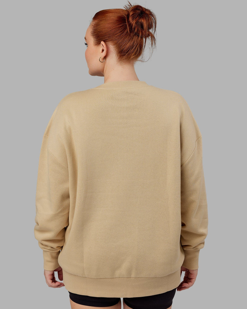 Model wearing Unisex Cornerstone Sweater Oversize - Pale Khaki