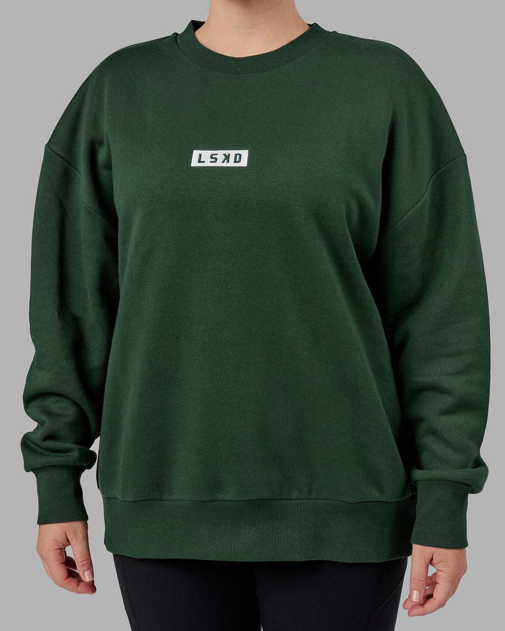 Model wearing Unisex Cornerstone Sweater Oversize - Pineneedle