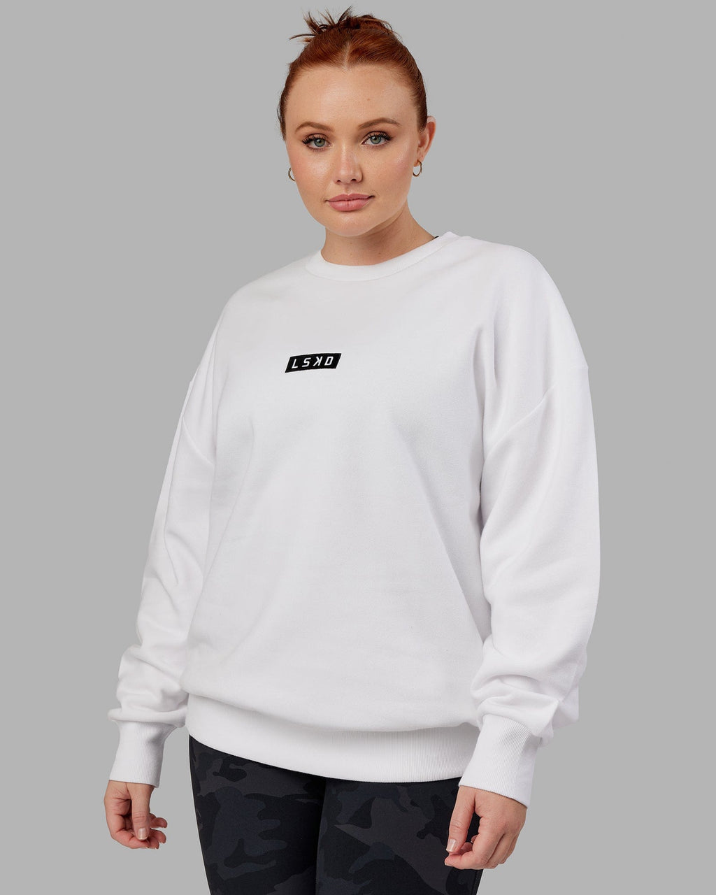 Model wearing Unisex Cornerstone Sweater Oversize - White