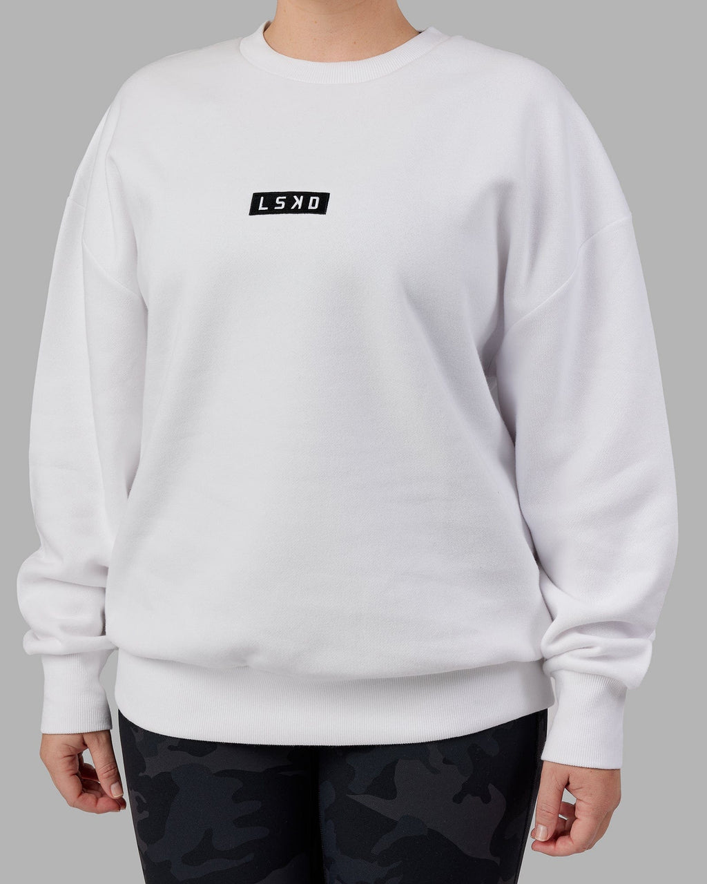 Model wearing Unisex Cornerstone Sweater Oversize - White