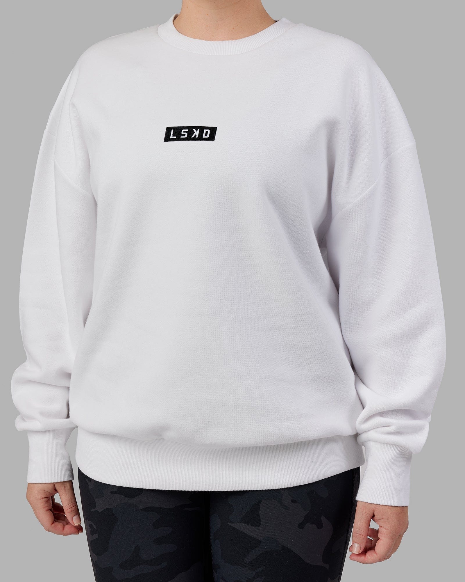 Model wearing Unisex Cornerstone Sweater Oversize - White