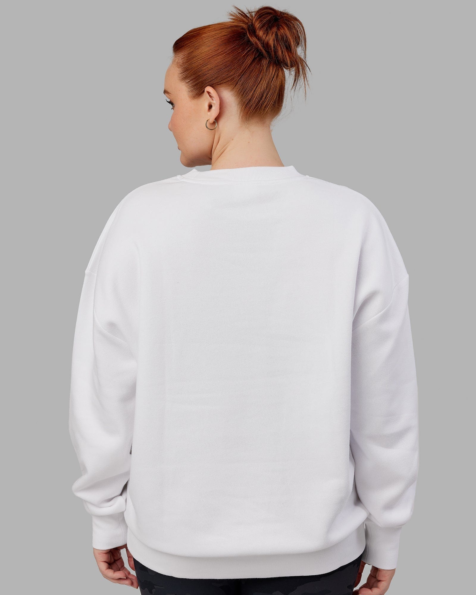 Model wearing Unisex Cornerstone Sweater Oversize - White