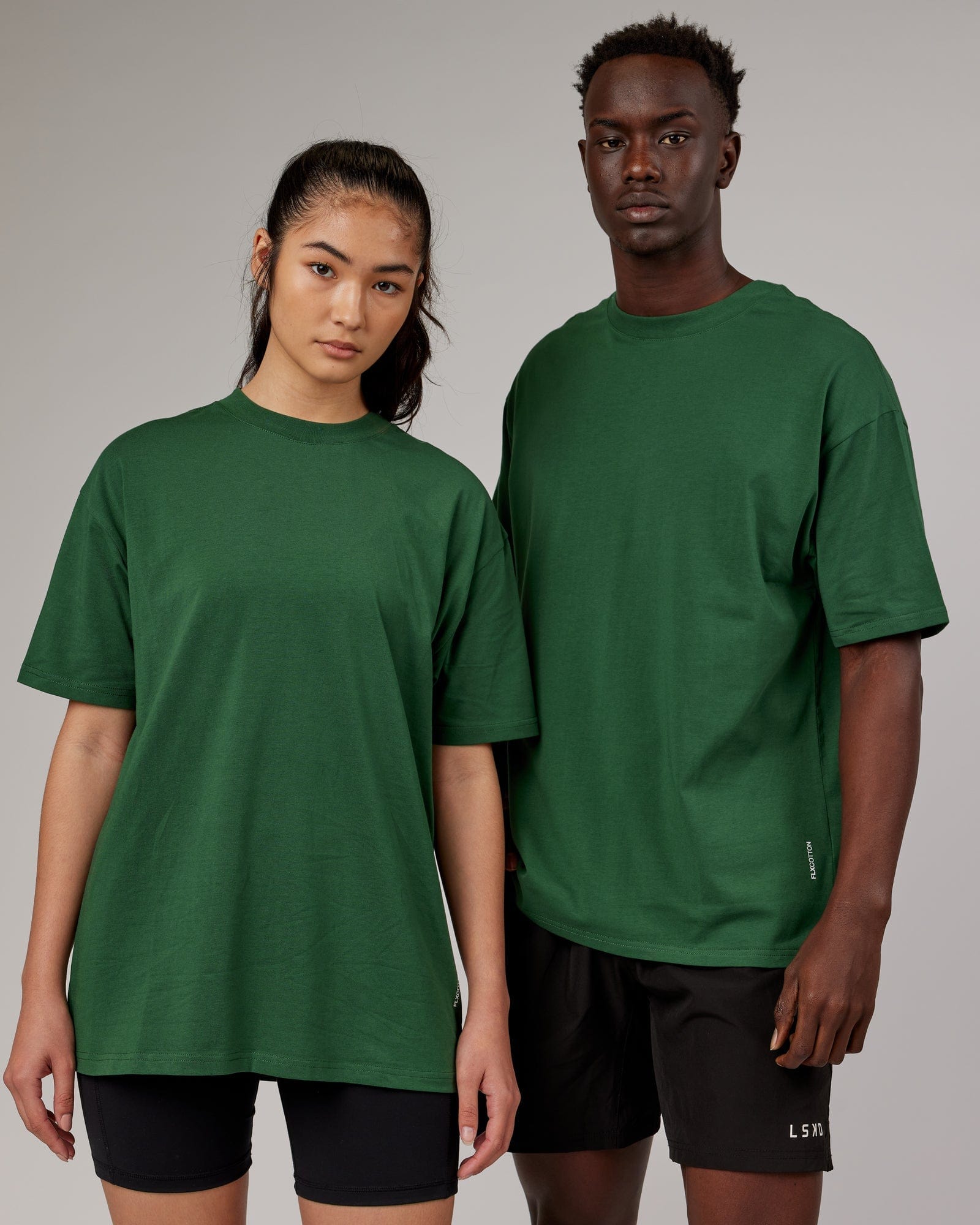 Model wearing Unisex DownLow FLXCotton Oversize Tee - Pineneedle