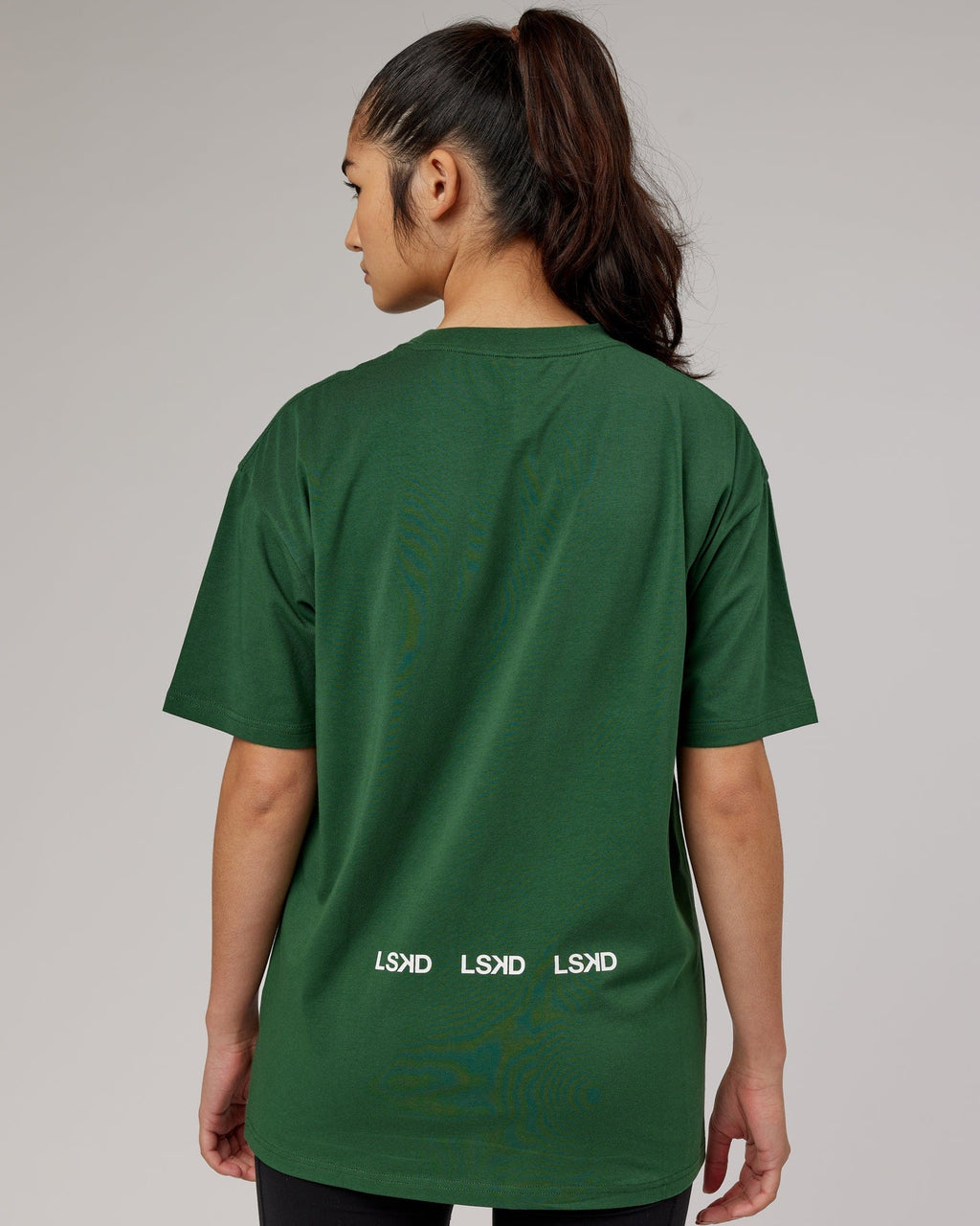 Model wearing Unisex DownLow FLXCotton Oversize Tee - Pineneedle