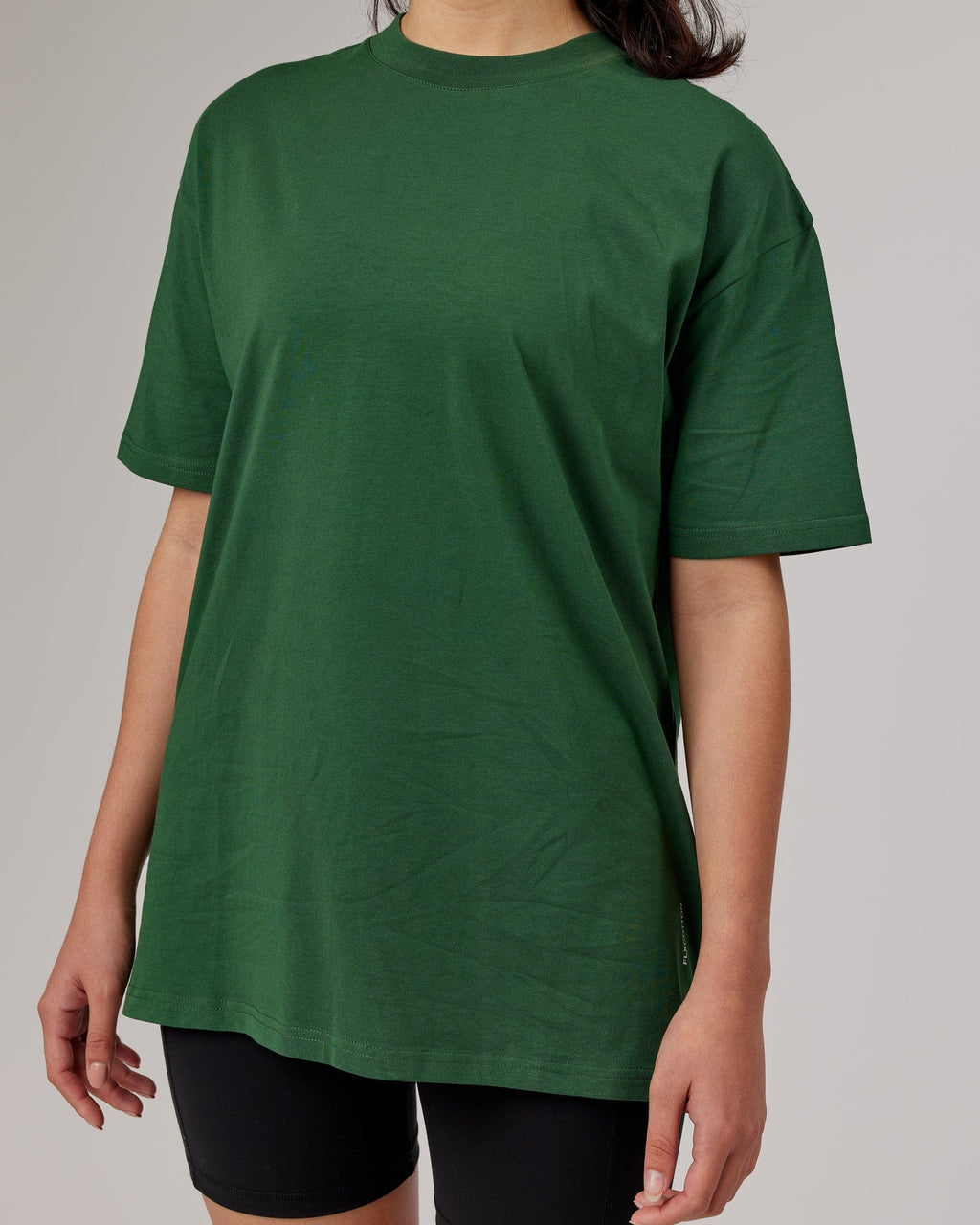 Model wearing Unisex DownLow FLXCotton Oversize Tee - Pineneedle