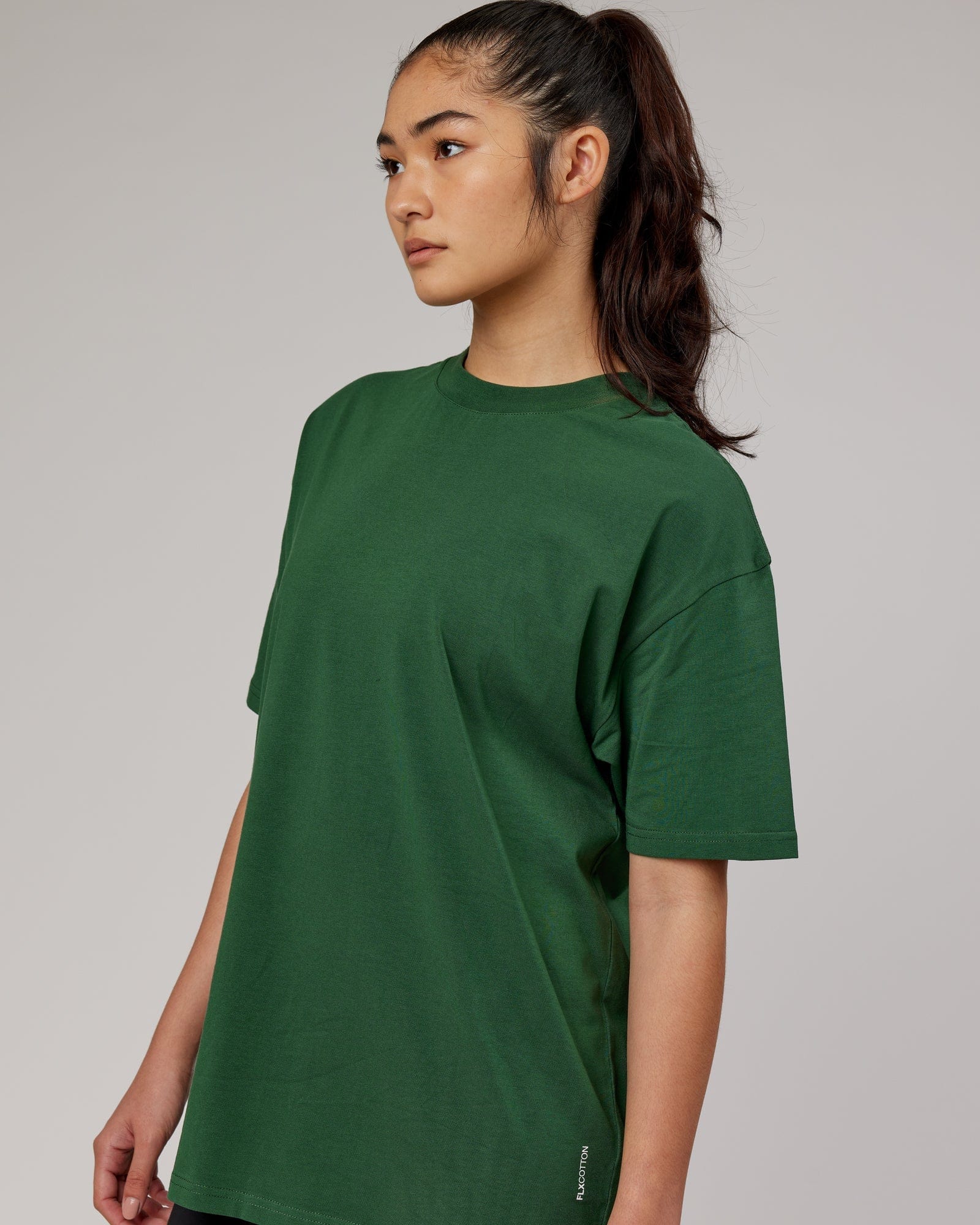 Model wearing Unisex DownLow FLXCotton Oversize Tee - Pineneedle