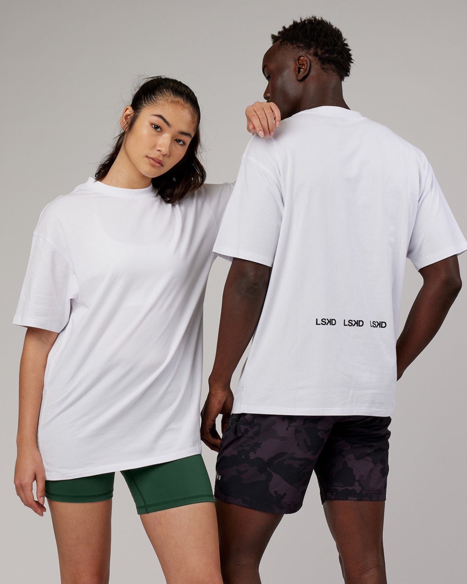 Model wearing Unisex DownLow FLXCotton Oversize Tee - White