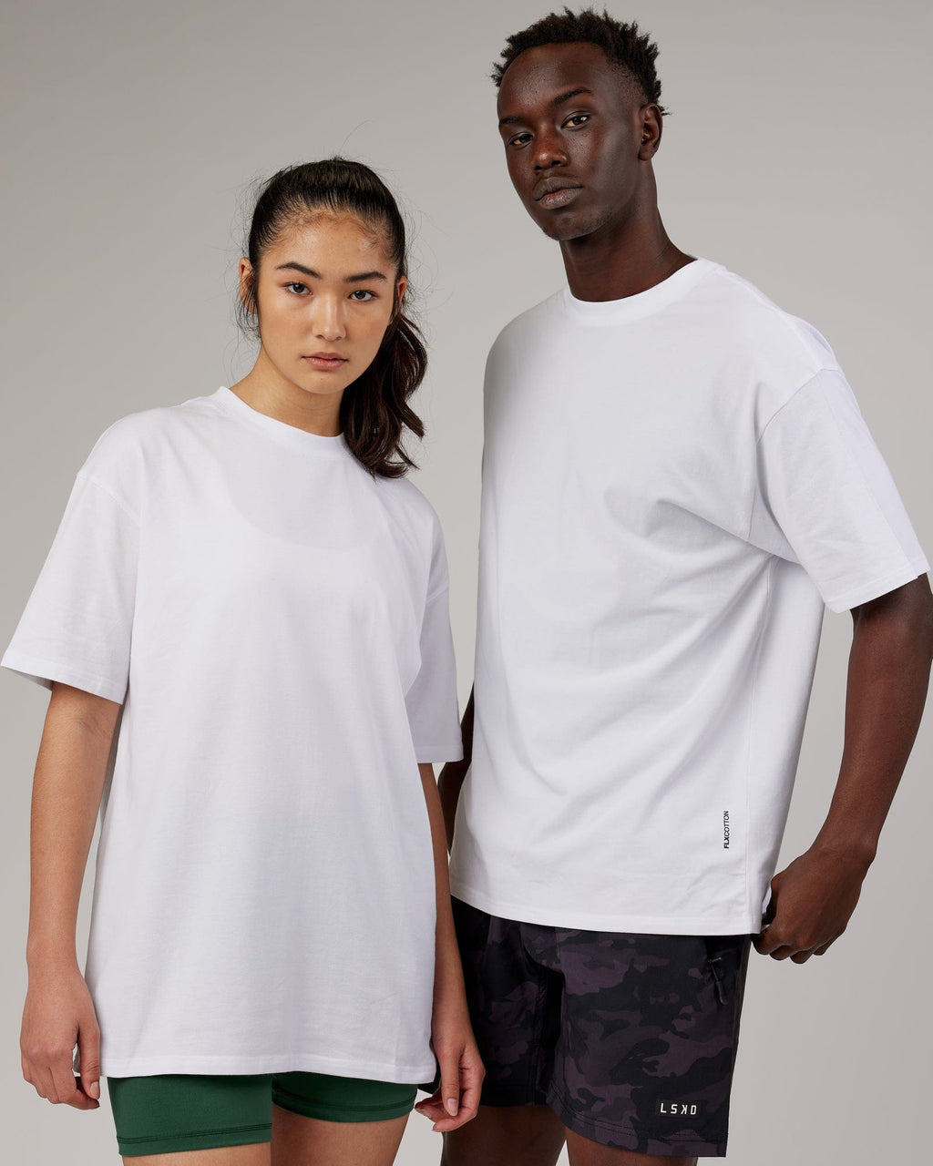 Model wearing Unisex DownLow FLXCotton Oversize Tee - White