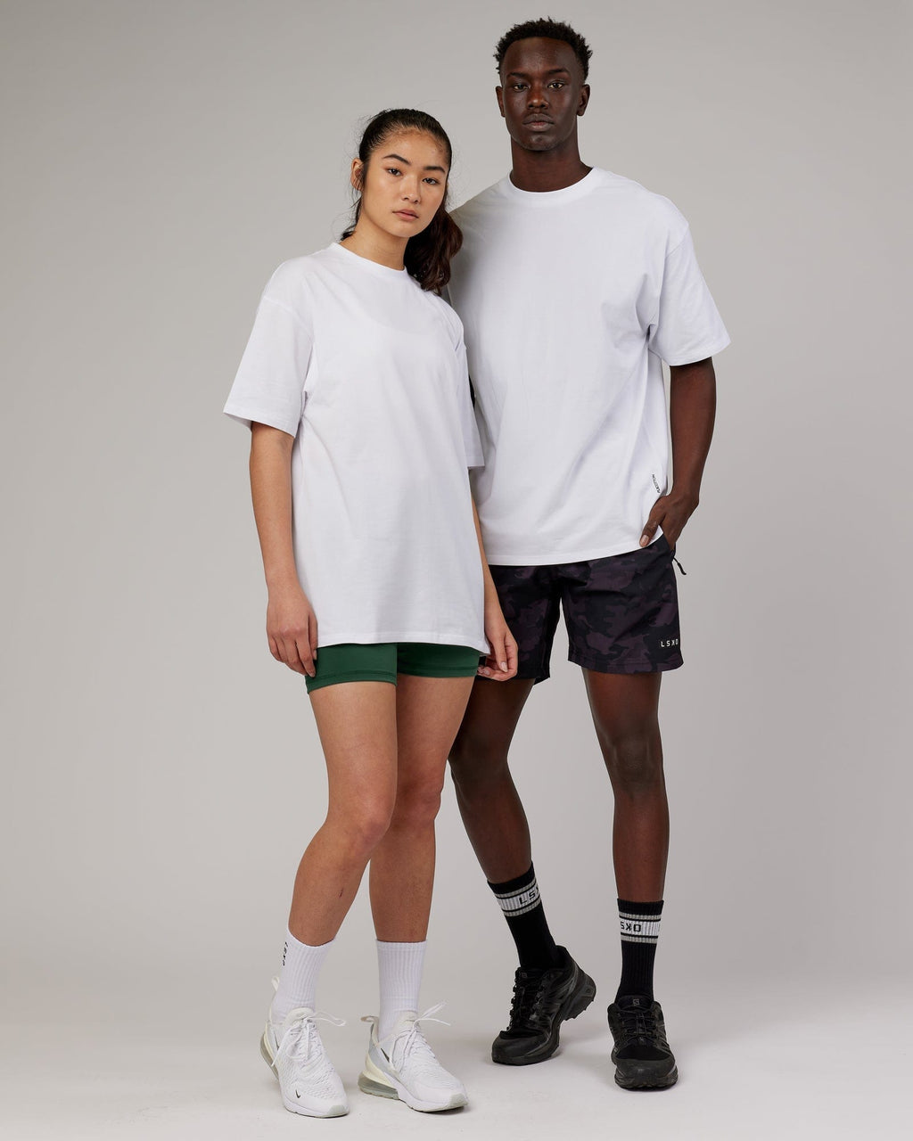 Model wearing Unisex DownLow FLXCotton Oversize Tee - White