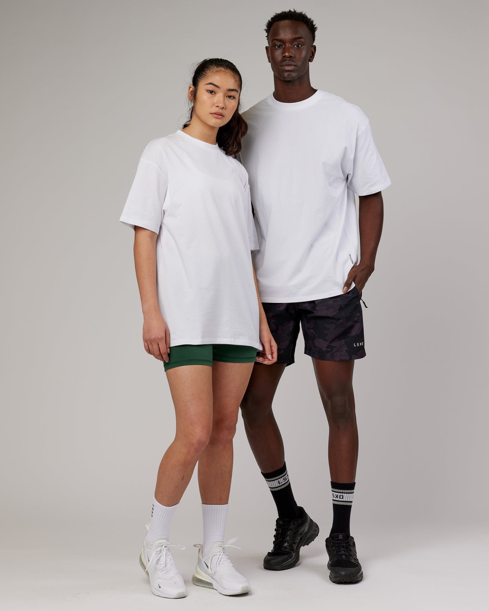 Model wearing Unisex DownLow FLXCotton Oversize Tee - White