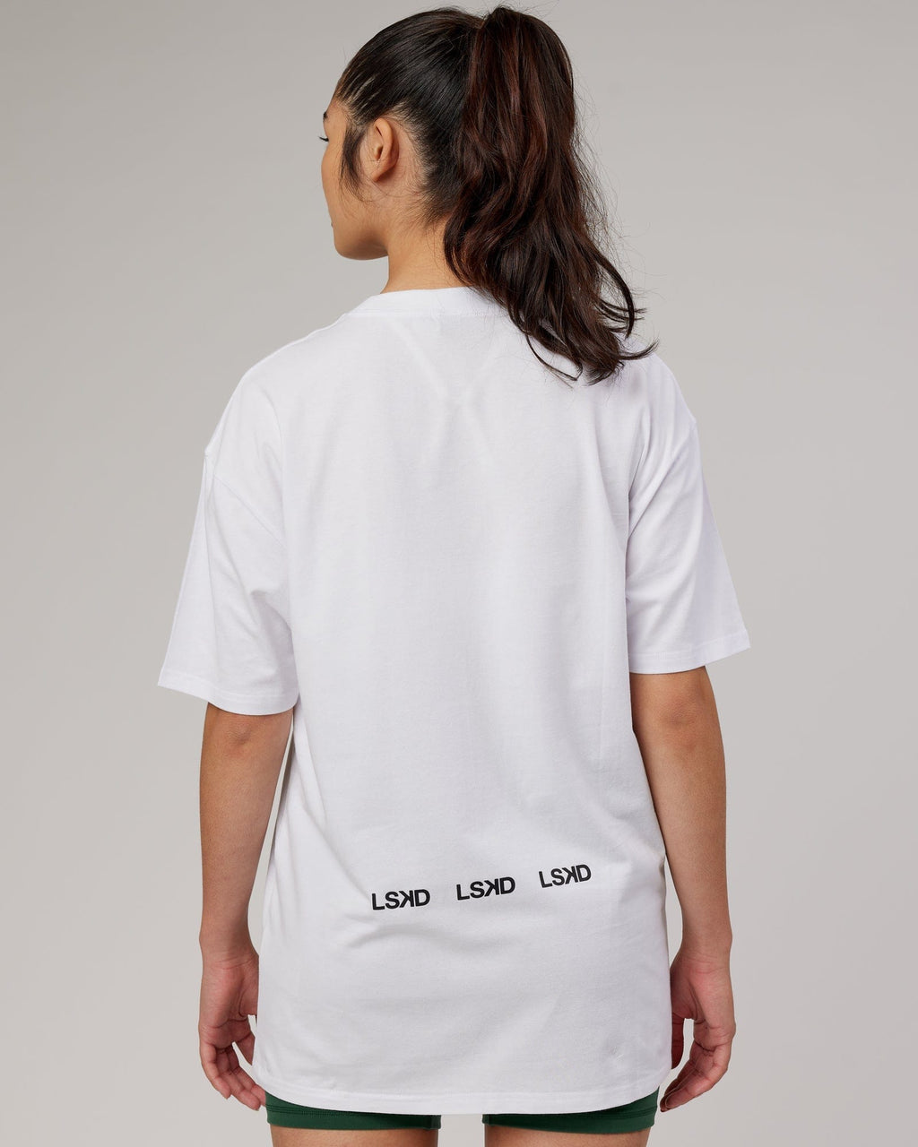 Model wearing Unisex DownLow FLXCotton Oversize Tee - White