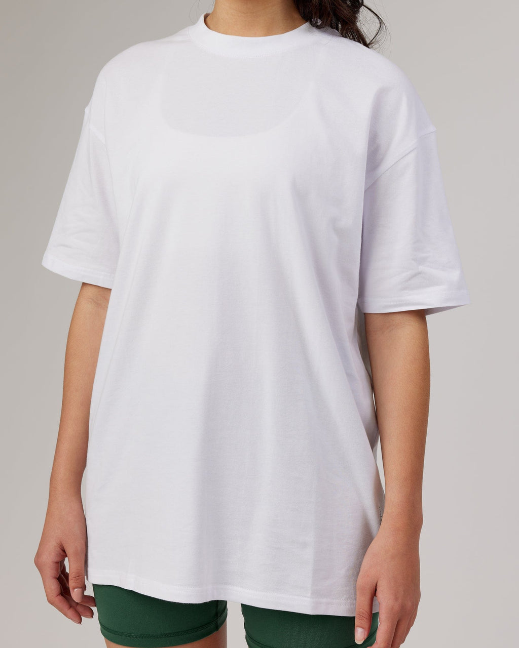 Model wearing Unisex DownLow FLXCotton Oversize Tee - White