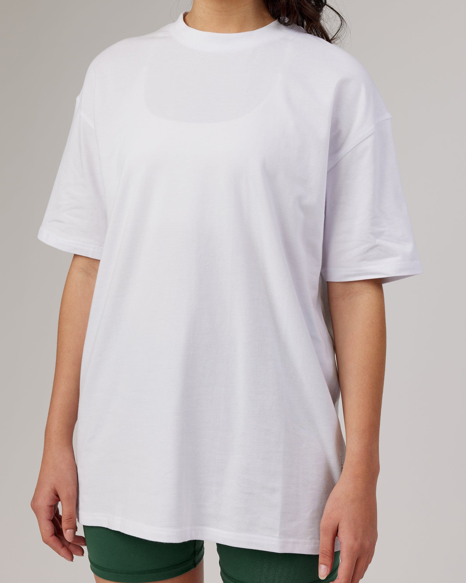 Model wearing Unisex DownLow FLXCotton Oversize Tee - White
