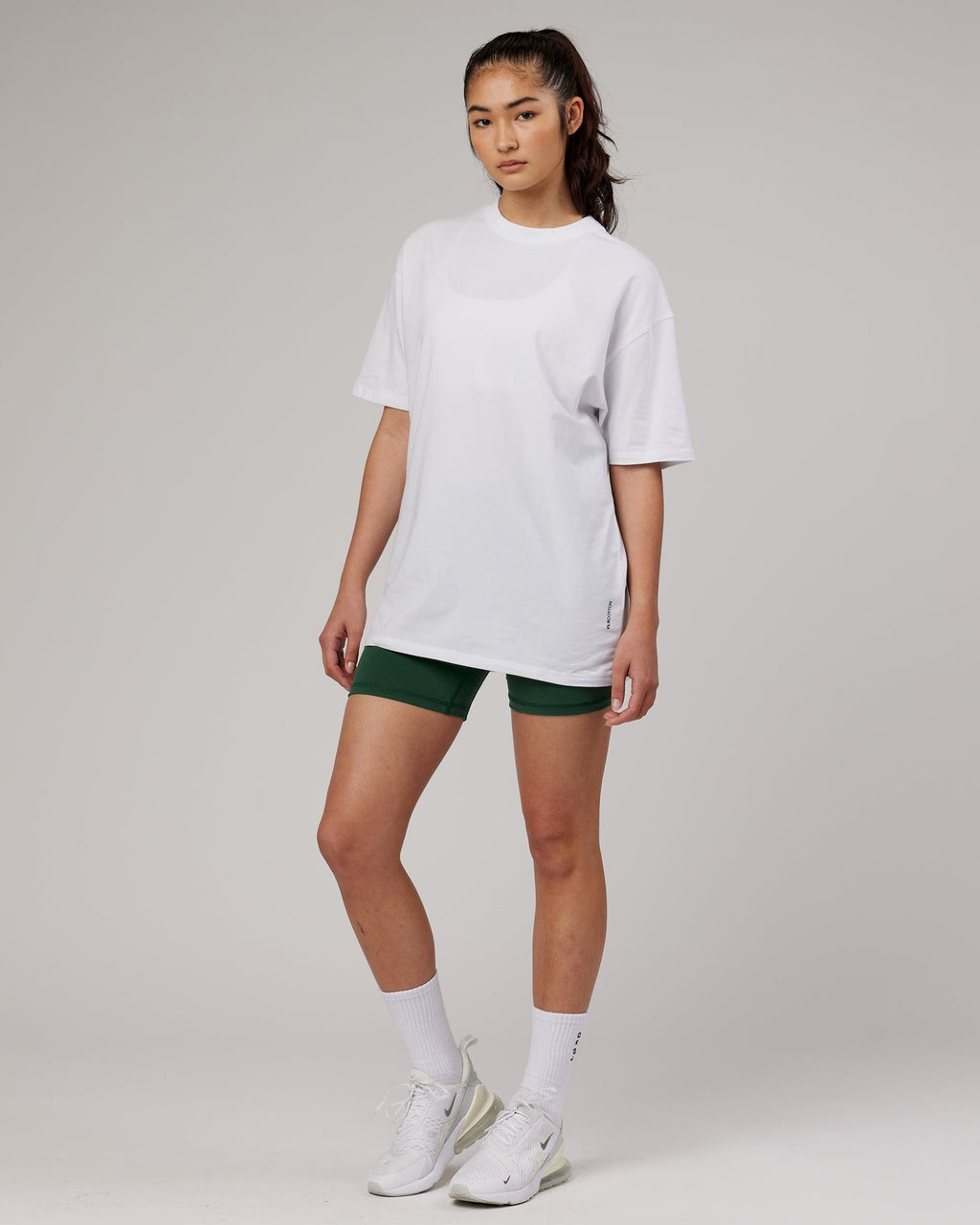 Model wearing Unisex DownLow FLXCotton Oversize Tee - White