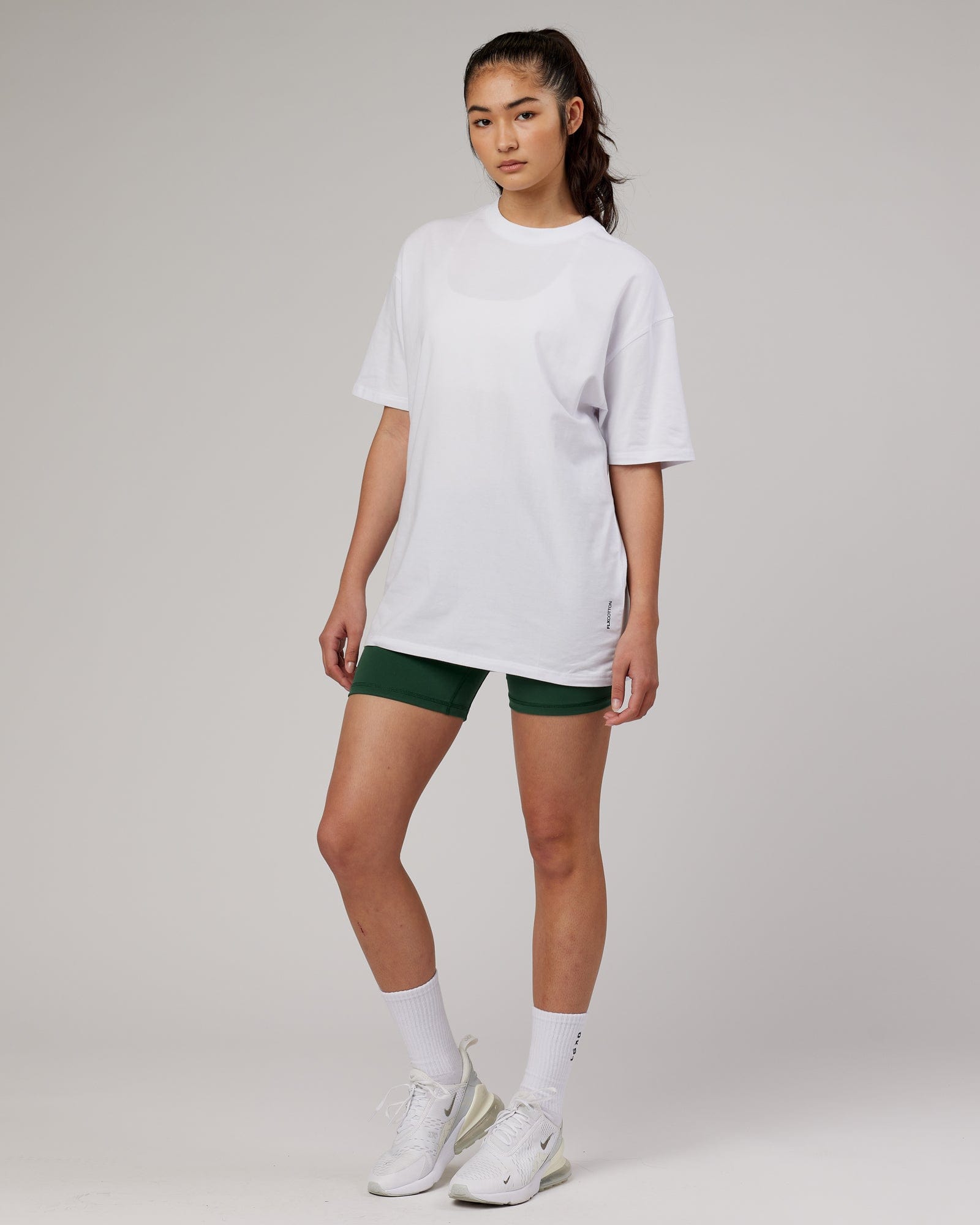 Model wearing Unisex DownLow FLXCotton Oversize Tee - White