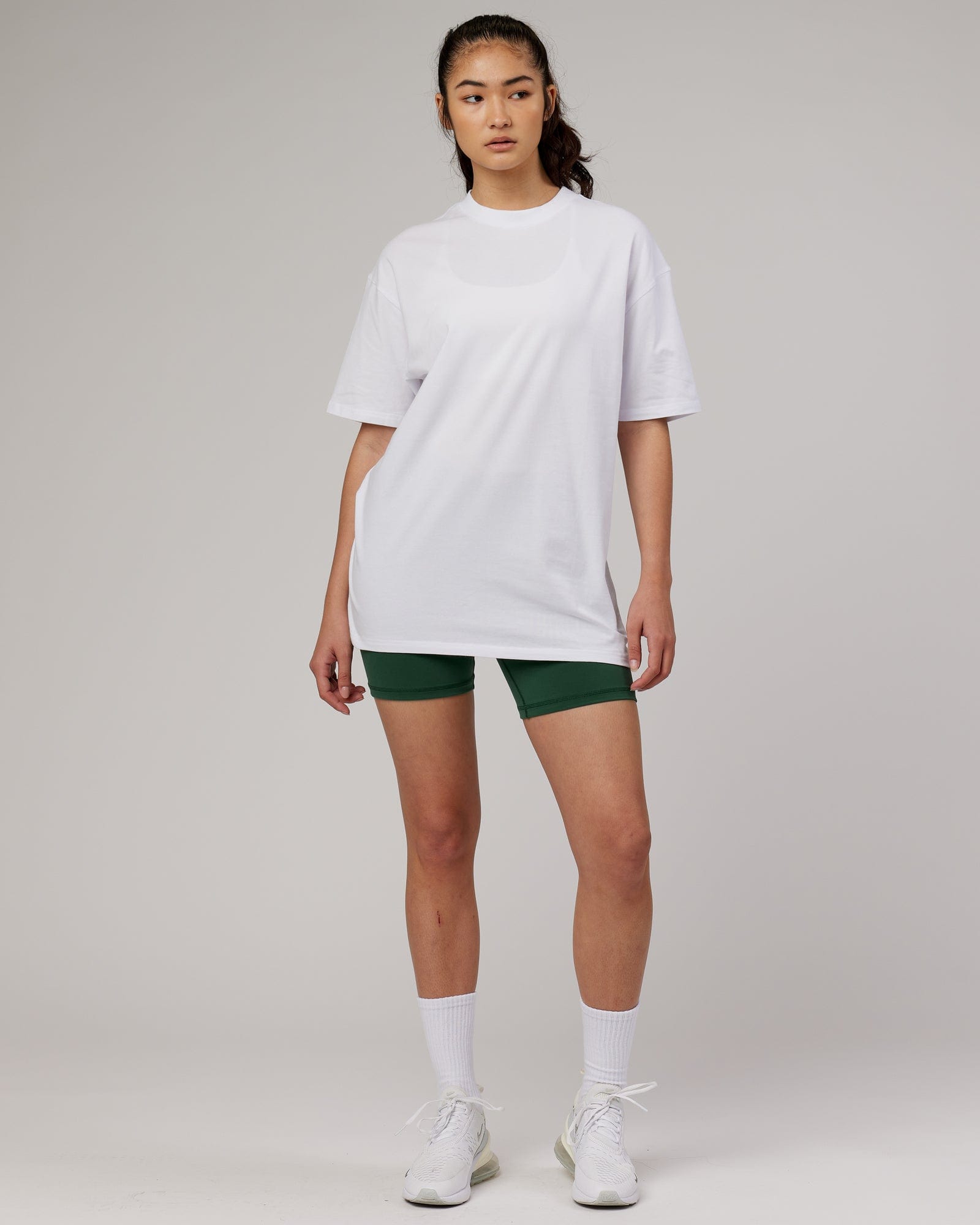 Model wearing Unisex DownLow FLXCotton Oversize Tee - White