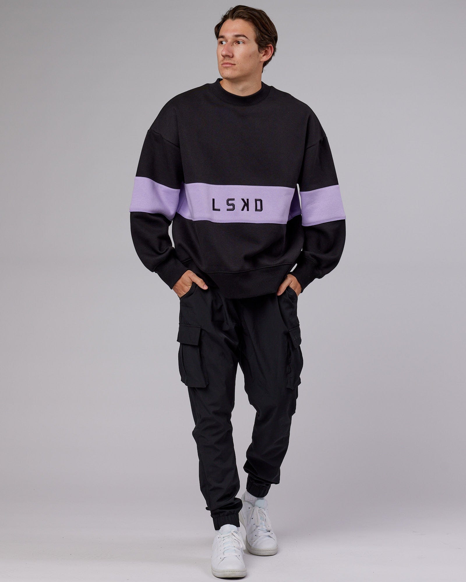 Model wearing Unisex Extra Time Sweater Oversize - Black-Pale Lilac