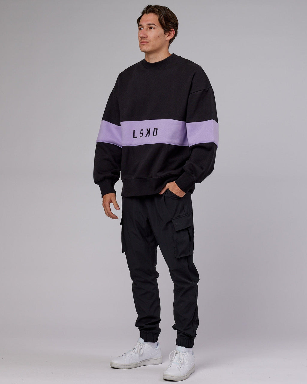 Model wearing Unisex Extra Time Sweater Oversize - Black-Pale Lilac