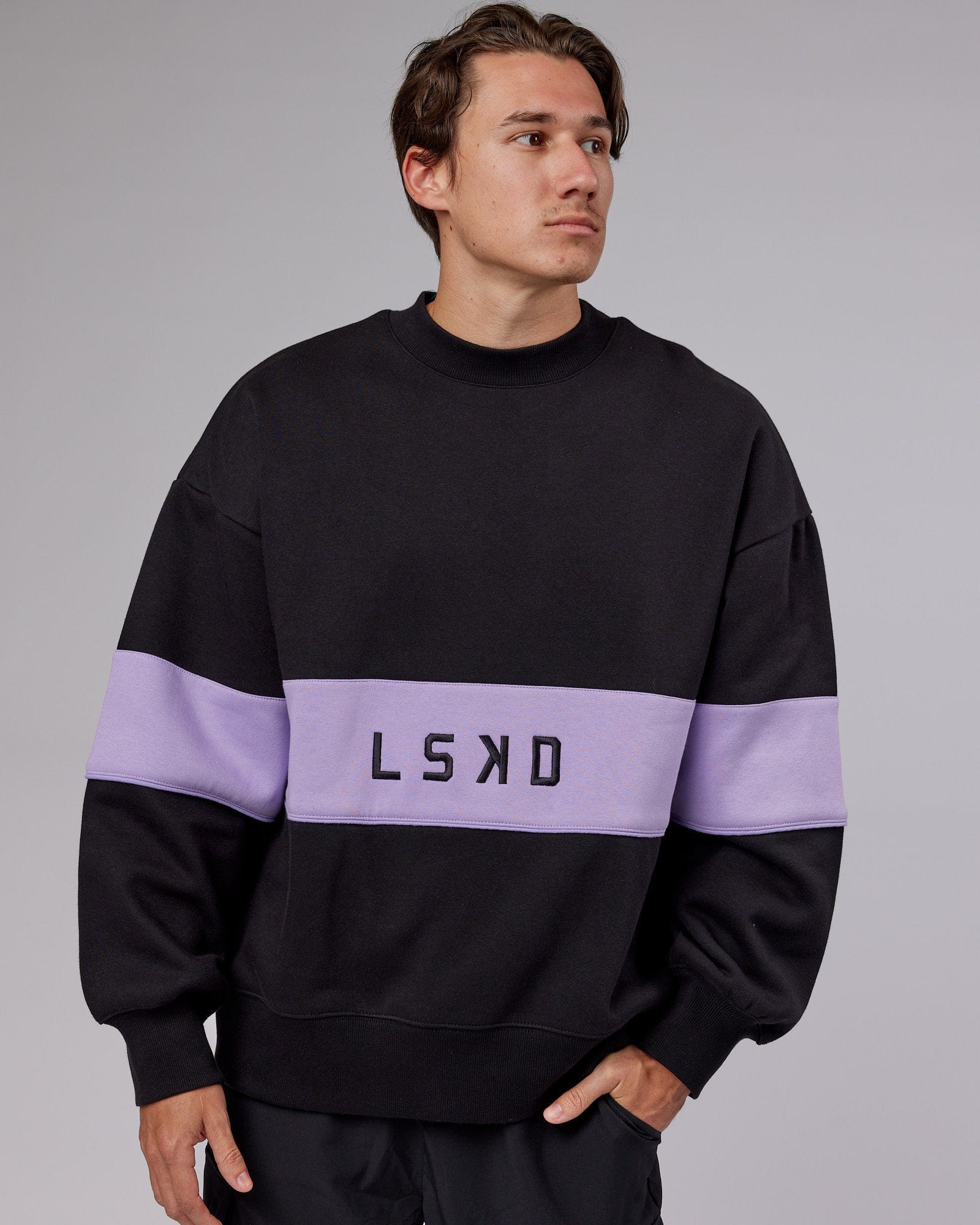 Model wearing Unisex Extra Time Sweater Oversize - Black-Pale Lilac