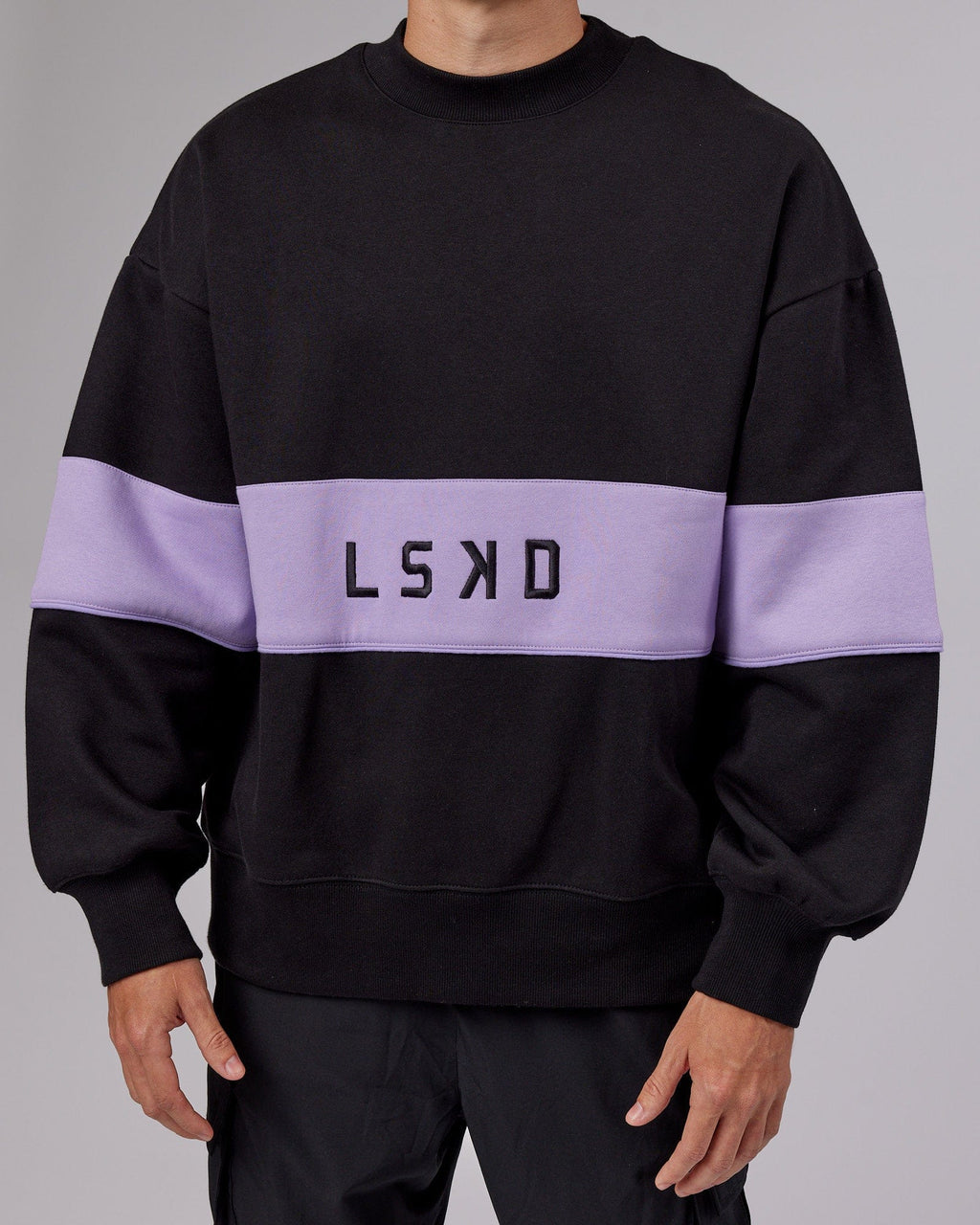 Model wearing Unisex Extra Time Sweater Oversize - Black-Pale Lilac