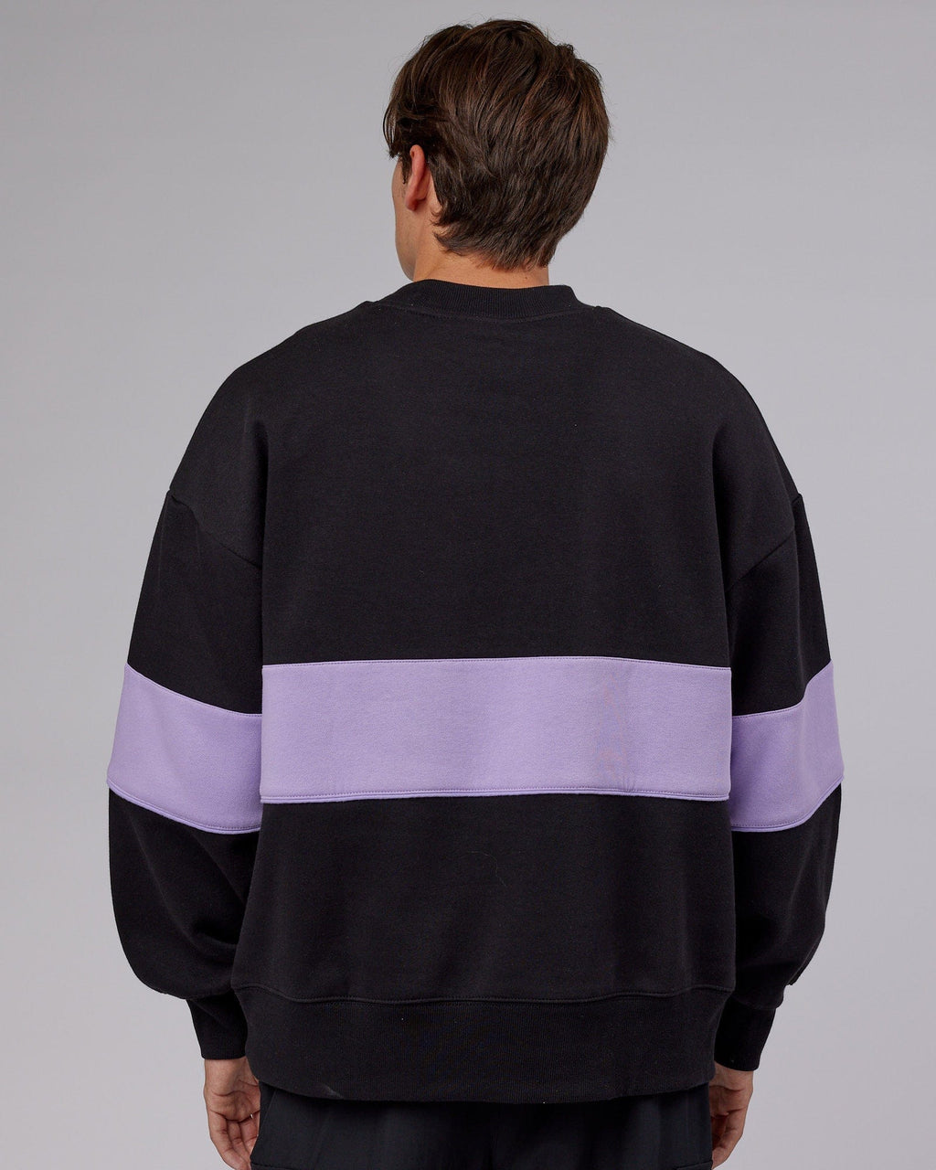 Model wearing Unisex Extra Time Sweater Oversize - Black-Pale Lilac