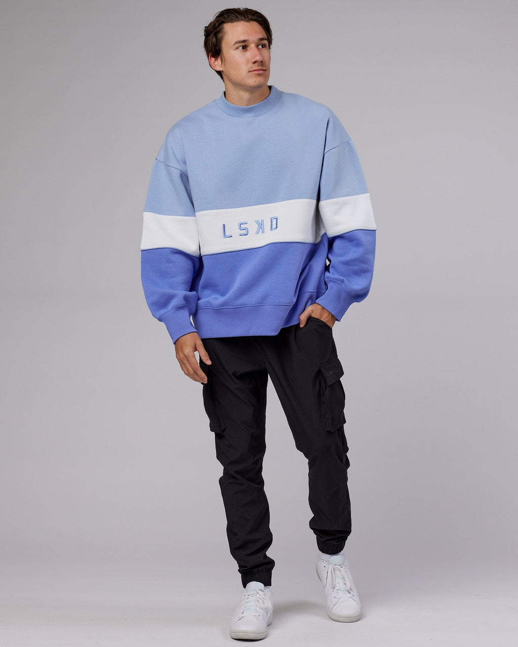 Model wearing Unisex Extra Time Sweater Oversize - Cornflower Blue-White