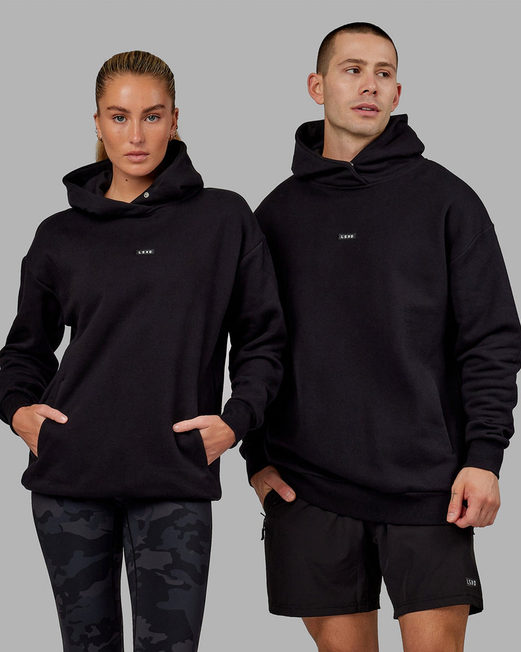 Model wearing Unisex Fundamental Hoodie Oversize - Black