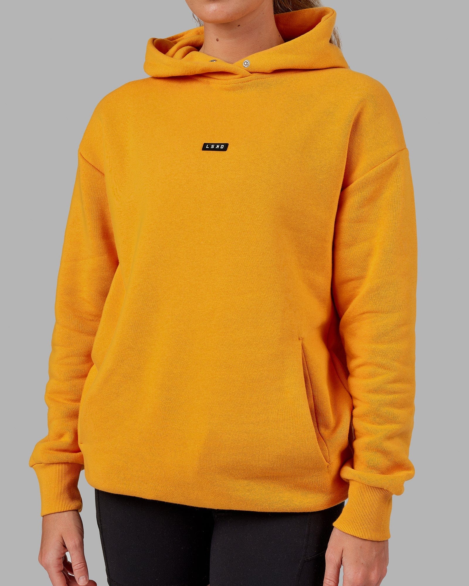 Model wearing Unisex Fundamental Hoodie Oversize - Butterscotch
