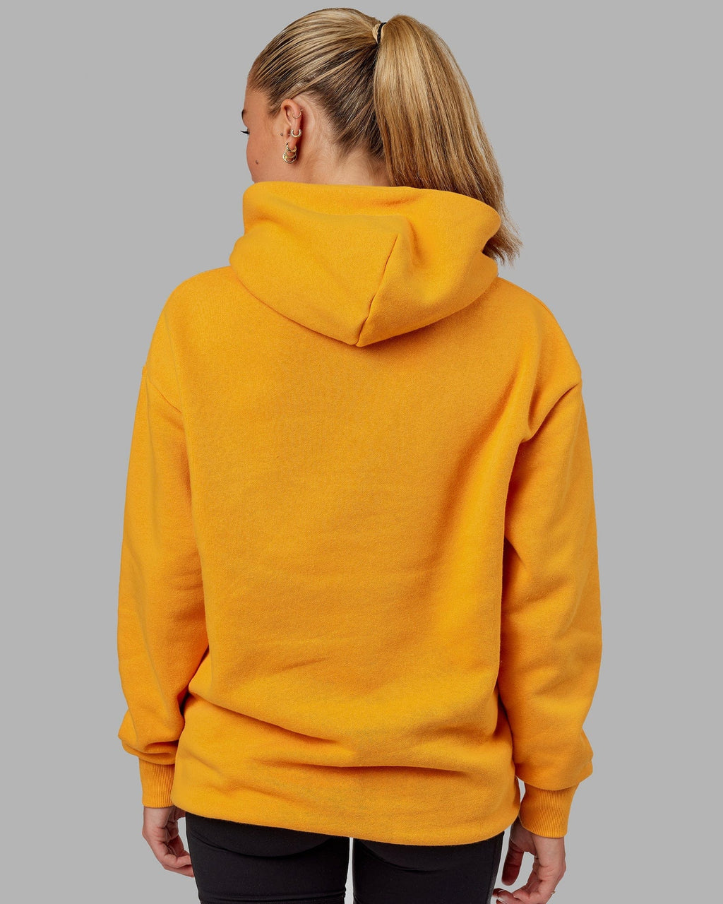 Model wearing Unisex Fundamental Hoodie Oversize - Butterscotch