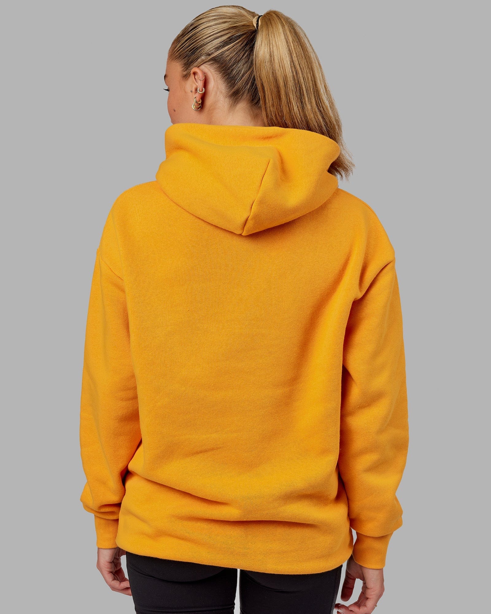 Model wearing Unisex Fundamental Hoodie Oversize - Butterscotch